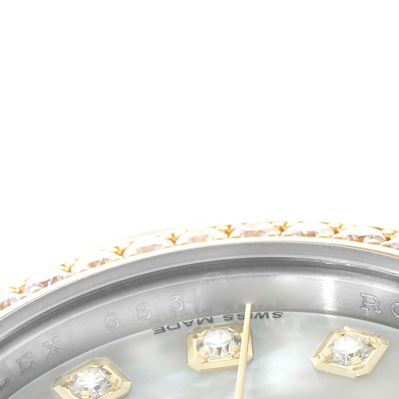 The image shows a close-up of the Rolex Datejust 179383 Women's Steel and Gold (two tone) Mother of Pearl Dial watch's bezel, dial edge, and diamond hour markers, viewed from an angle.