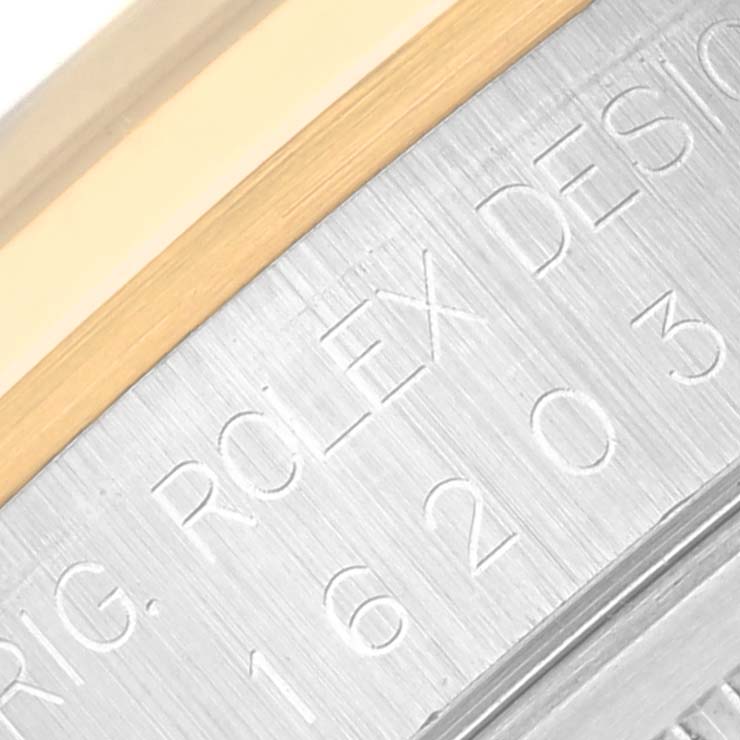 Close-up view of the bezel and engraved side of a Rolex Datejust 16203 Men's Steel and Gold (two tone) Grey Dial 16203 Men's Steel and Gold (two tone) Grey Dial watch.