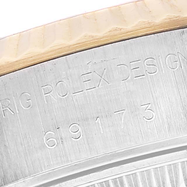 The image shows the side view of a Rolex Datejust 69173 Women's Steel and Gold (two tone) White Dial 69173 Women's Steel and Gold (two tone) White Dial model with visible engraved model number "69173" and part of the bezel.