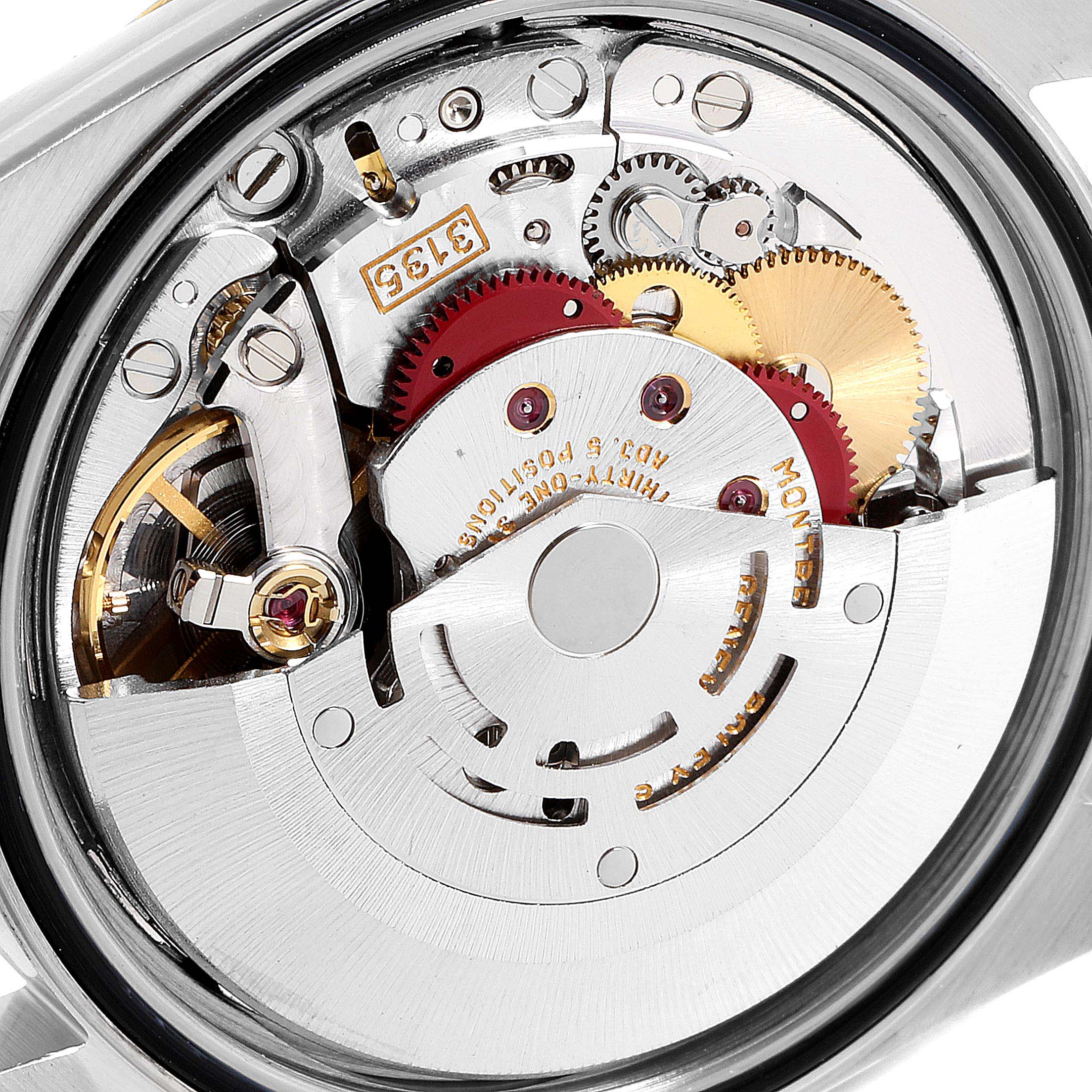 The image shows the internal mechanical movement of a Rolex Datejust 16233 Men's Steel and Gold (two tone) White Dial 16233 Men's Steel and Gold (two tone) White Dial watch, focusing on the gears and rotor.