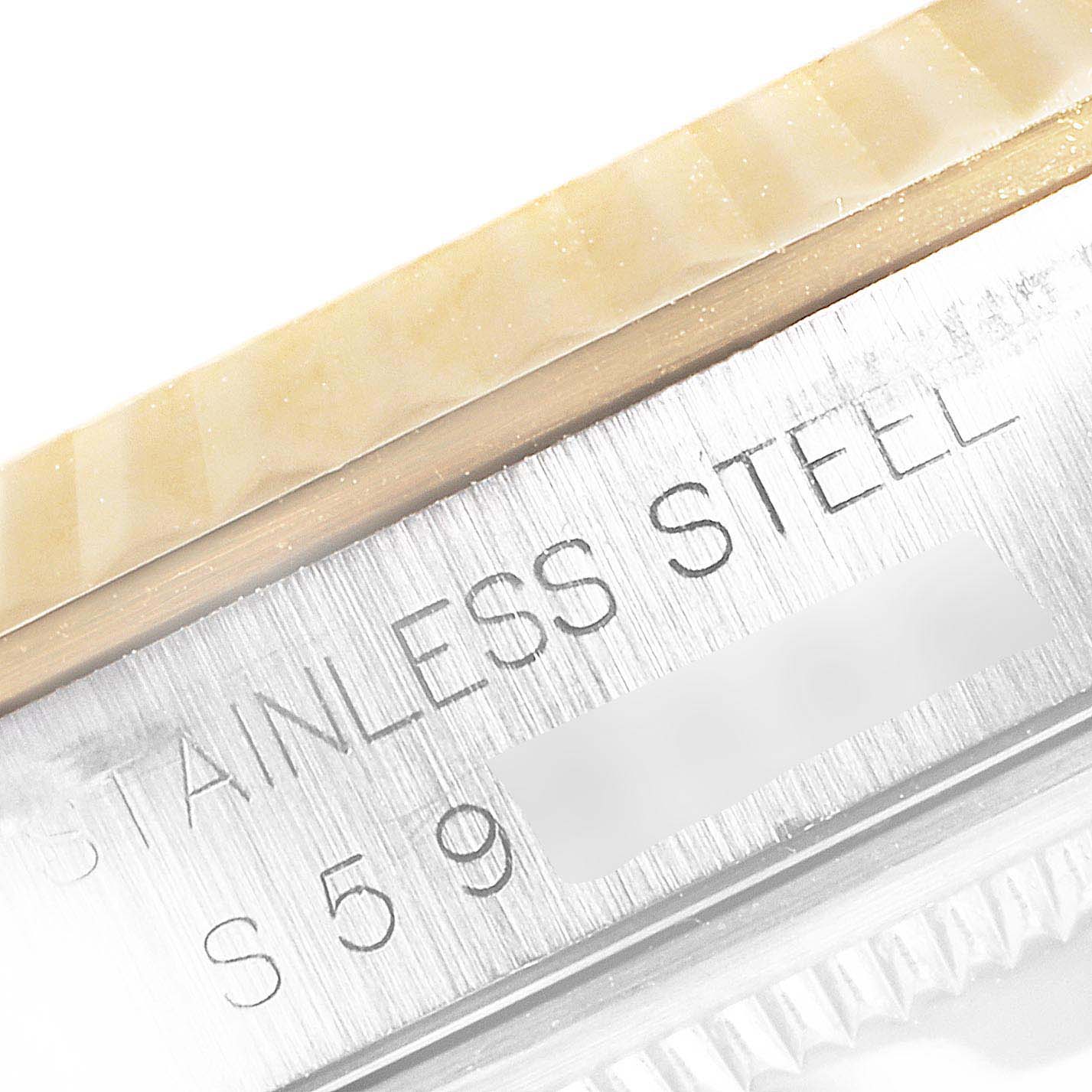 The image shows a close-up angle of the stainless steel case with serial number engraving of a Rolex Datejust 16233 Men's Steel and Gold (two tone) White Dial 16233 Men's Steel and Gold (two tone) White Dial watch.