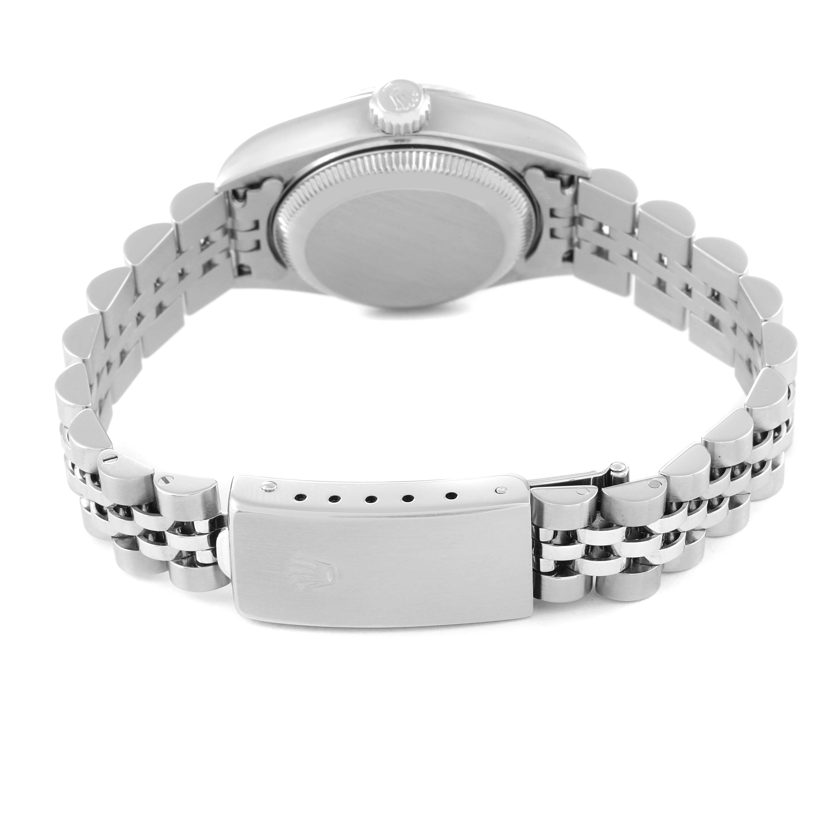 This image shows the back case, crown, and bracelet clasp of a Rolex Datejust 79174 Women's Stainless Steel Black Dial 79174 Women's Stainless Steel Black Dial watch.