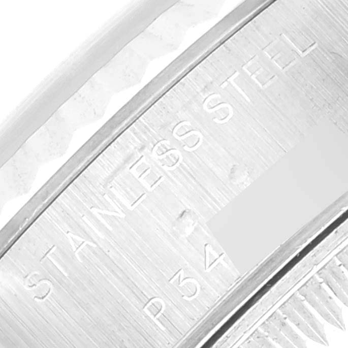 This image shows a close-up view of the engraved text on the back of a Rolex Datejust 79174 Women's Stainless Steel Black Dial 79174 Women's Stainless Steel Black Dial watch, highlighting the "STAINLESS STEEL" marking.