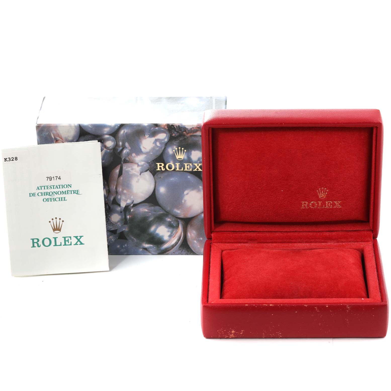 This image shows a Rolex Datejust 79174 Women's Stainless Steel Black Dial 79174 Women's Stainless Steel Black Dial box, the outer box, and the official chronometer certification booklet.