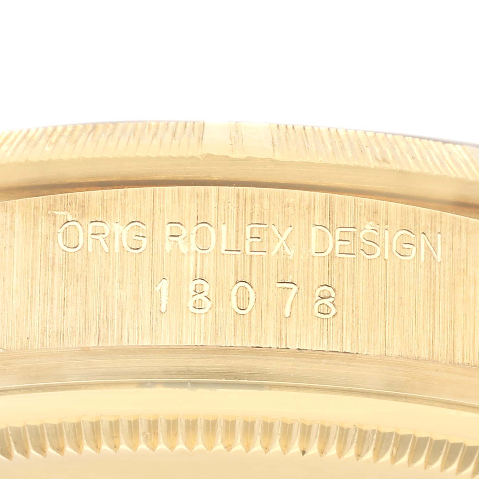 The image shows a close-up of the side of the Rolex President 18248 Men
s Yellow Gold Champagne Dial 18248 Men
s Yellow Gold Champagne Dial model, highlighting the "ORIG ROLEX DESIGN 18078" engraving.
