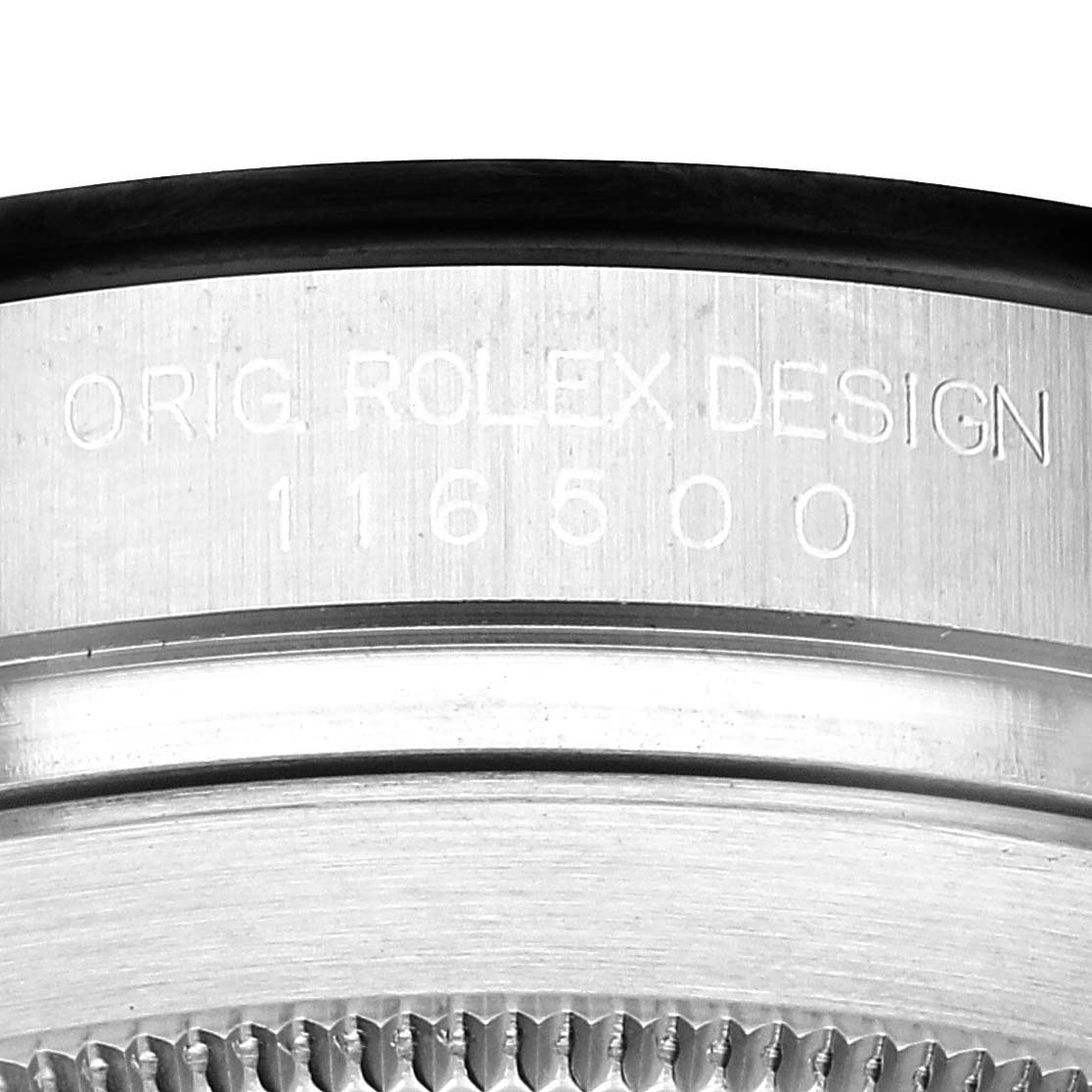 The image shows a close-up of the side of a Rolex Daytona 116500 Men's Stainless Steel White Dial 116500 Men's Stainless Steel White Dial watch case with engraved model number 116500.
