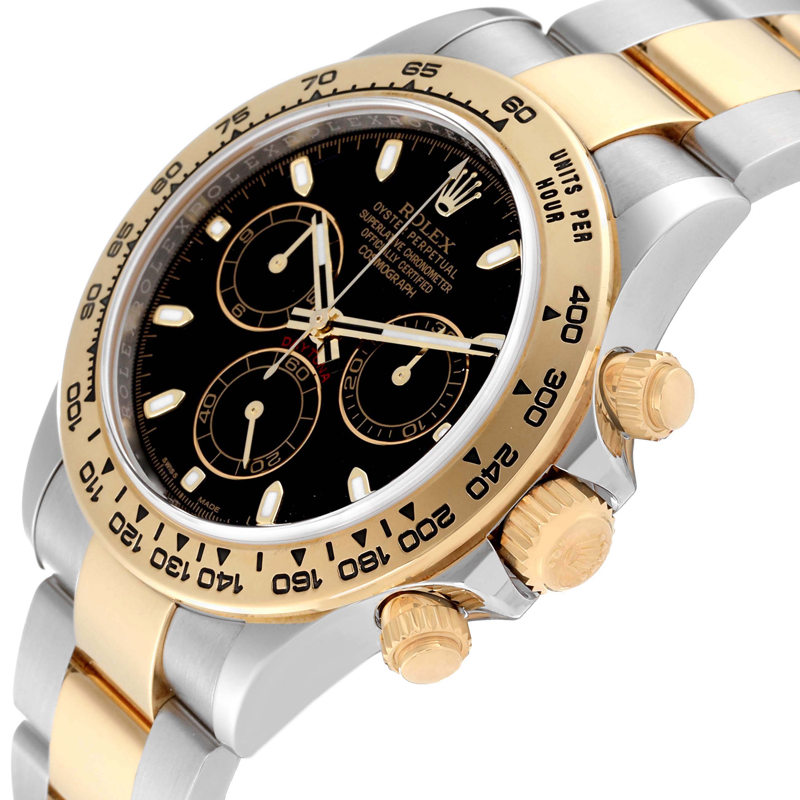 The image shows a side angle of a Rolex Daytona 116503 Men
s Steel and Gold (two tone) Black Dial 116503 Men
s Steel and Gold (two tone) Black Dial watch, highlighting the bezel, crown, chronograph pushers, and a portion of the bracelet.