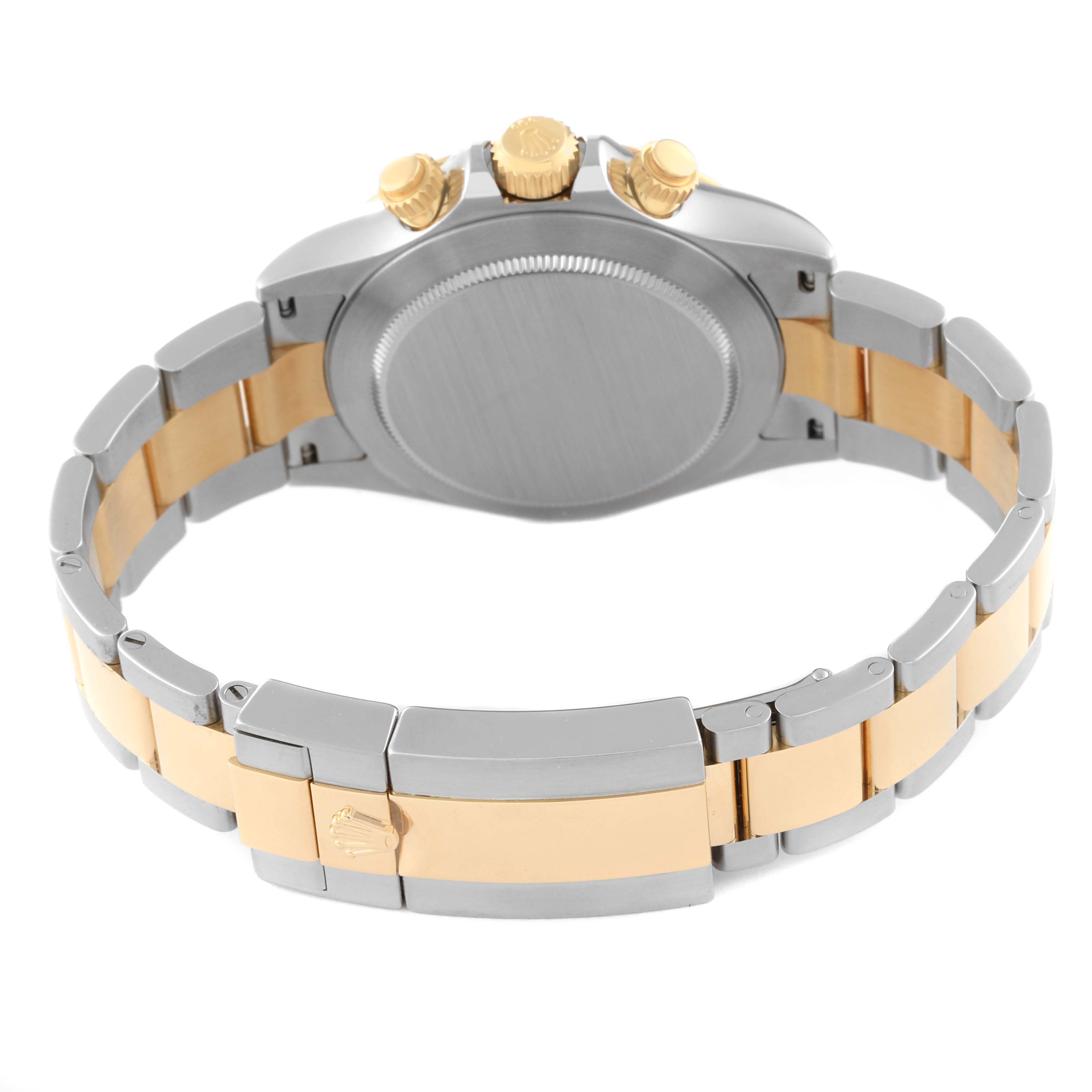 The image shows the back of the Rolex Daytona 116503 Men
s Steel and Gold (two tone) Black Dial 116503 Men
s Steel and Gold (two tone) Black Dial watch, highlighting its stainless steel and gold link bracelet and the clasp.