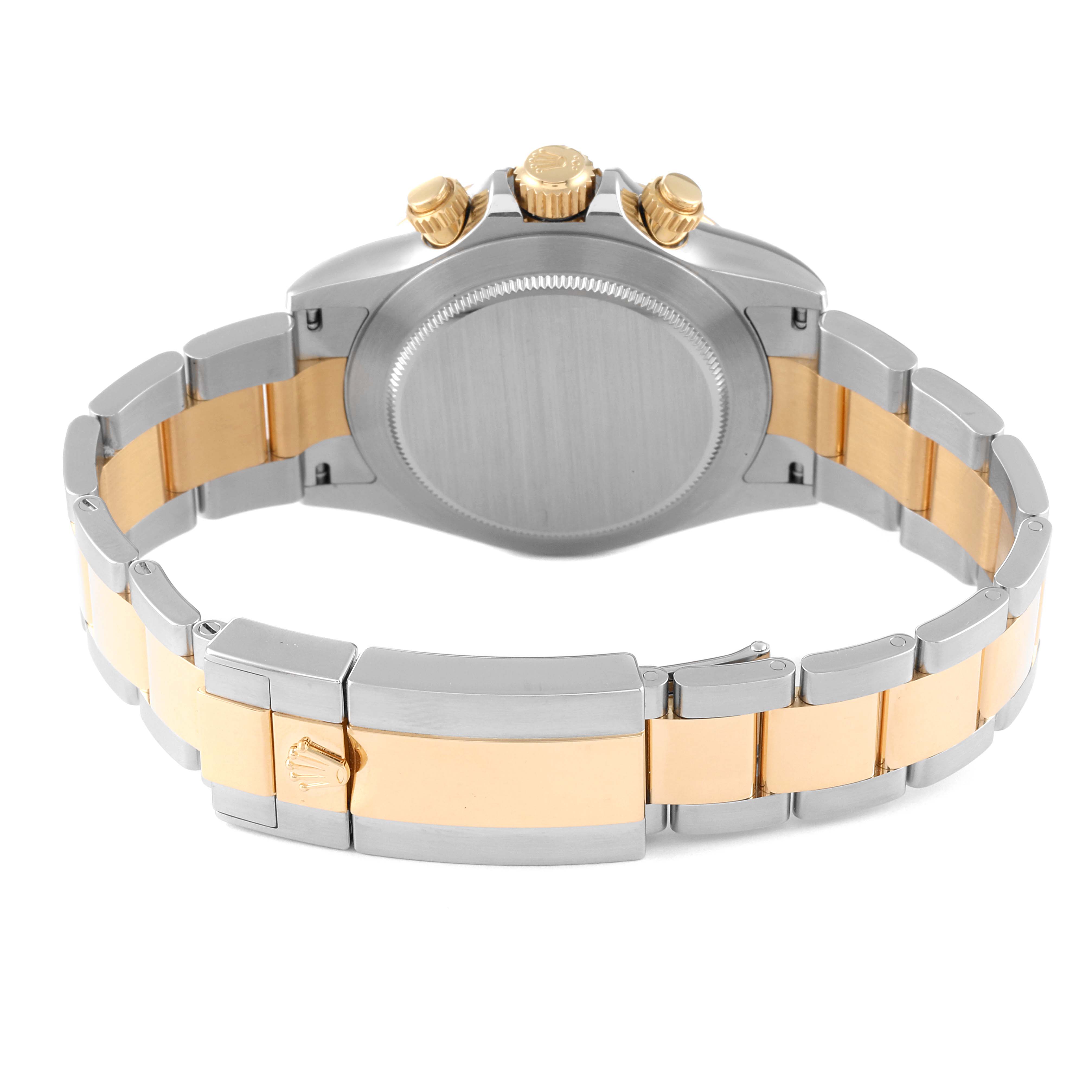 The image shows the back of a Rolex Daytona 116503 Men's Steel and Gold (two tone) Mother of Pearl Dial 116503 Men's Steel and Gold (two tone) Mother of Pearl Dial watch, displaying its case, crown, and two-tone bracelet.