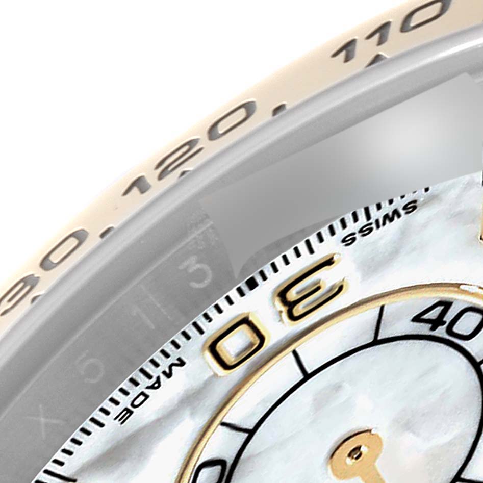 This close-up image shows the bezel and part of the dial of the Rolex Daytona 116503 Men's Steel and Gold (two tone) Mother of Pearl Dial 116503 Men's Steel and Gold (two tone) Mother of Pearl Dial watch.