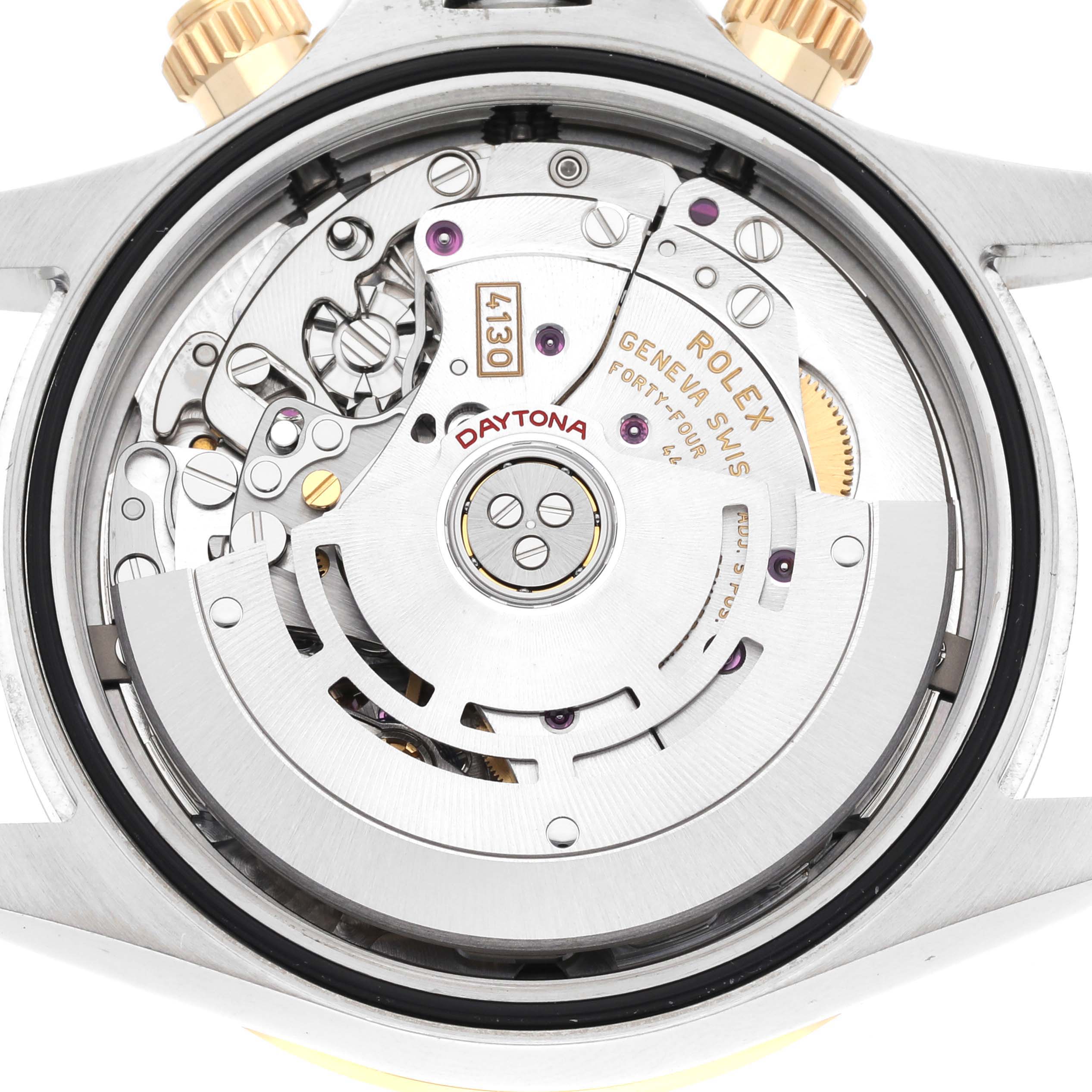 This image shows the intricate mechanics and movement parts of a Rolex Daytona 116503 Men's Steel and Gold (two tone) Black Dial 116503 Men's Steel and Gold (two tone) Black Dial watch from a back view angle.