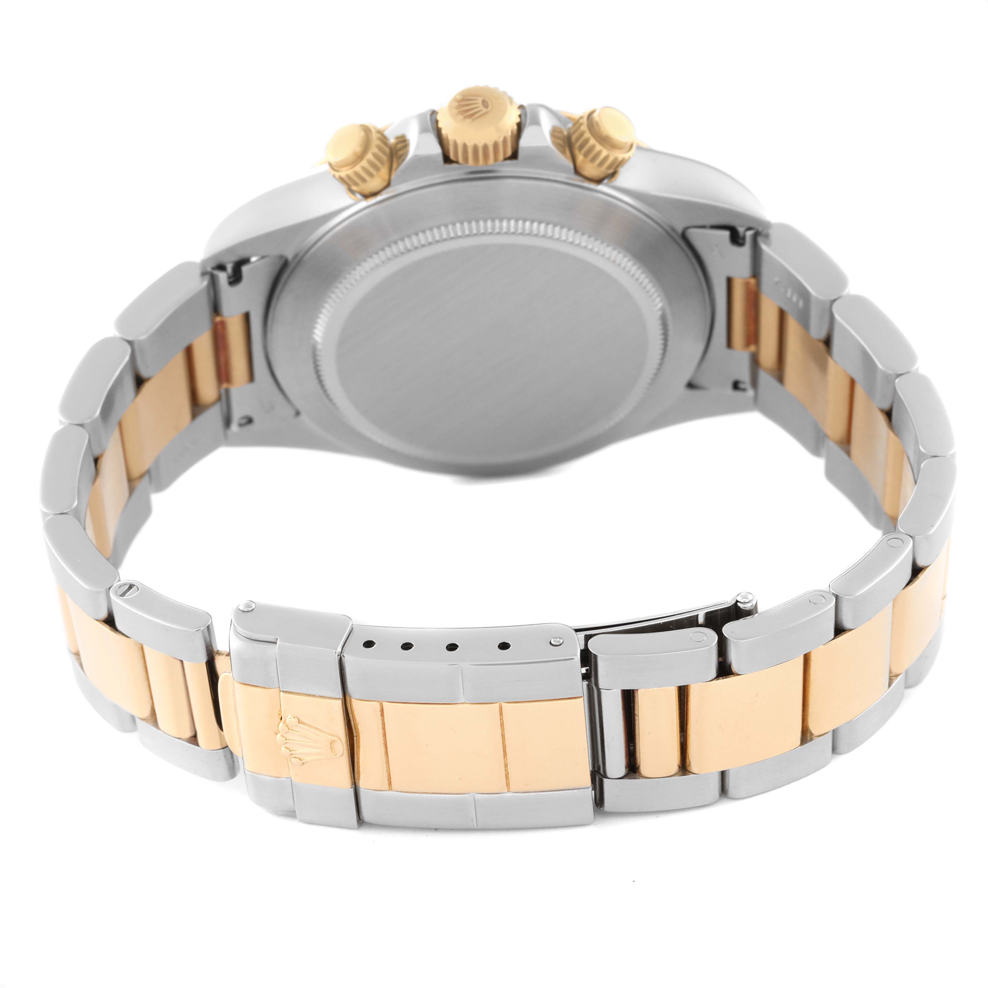 This image shows the back case, crown, and bracelet of a Rolex Daytona 16523 Men's Steel and Gold (two tone) Champagne Dial 16523 Men's Steel and Gold (two tone) Champagne Dial watch.