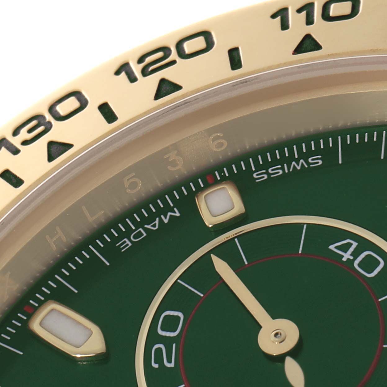 The image shows a close-up of the dial and bezel of a Rolex Daytona 116508 Men's Yellow Gold Green Dial, highlighting the tachymetric scale and part of the dial.