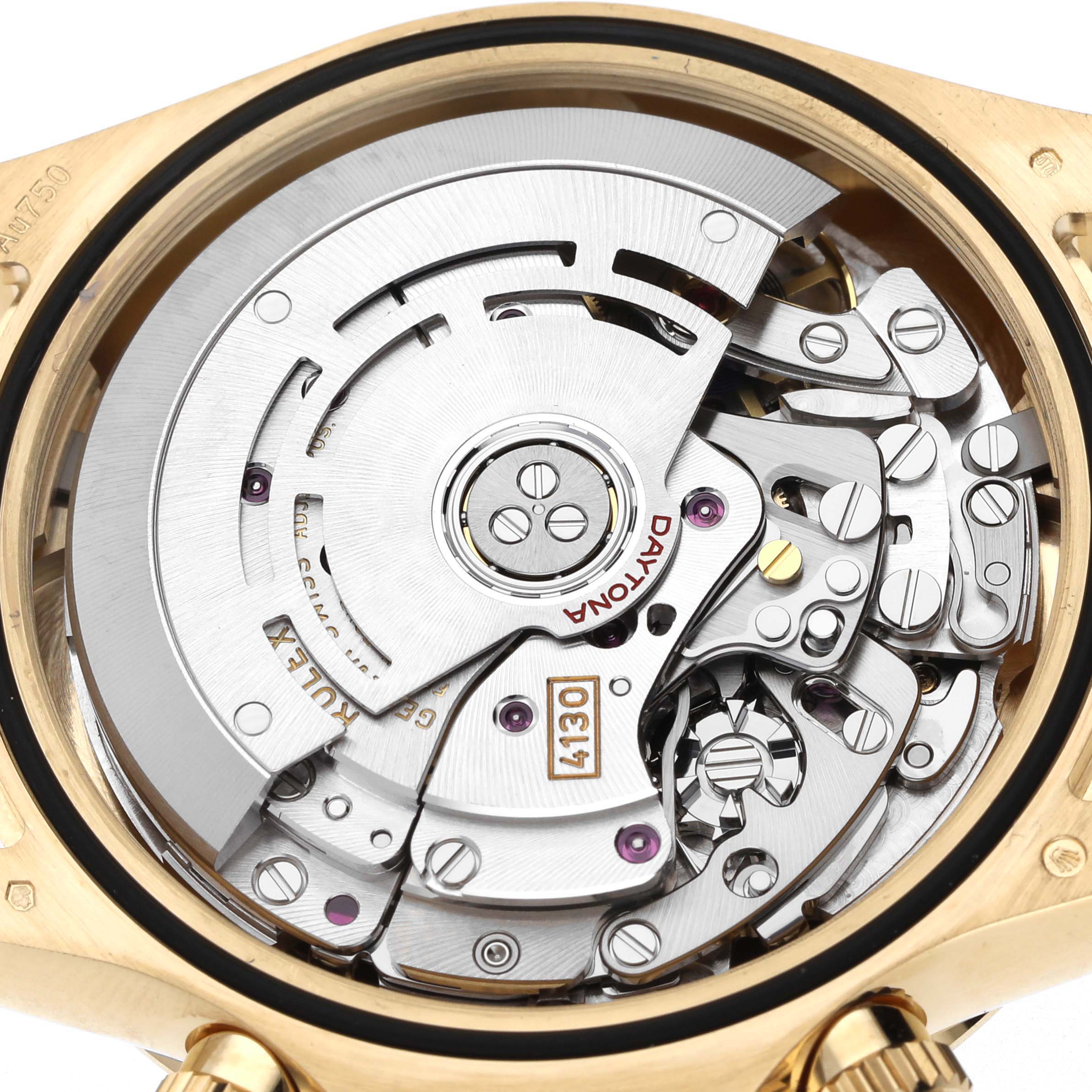 The image shows the movement of a Rolex Daytona 116508 Men's Yellow Gold Green Dial watch viewed from the back, highlighting the intricate mechanical components.