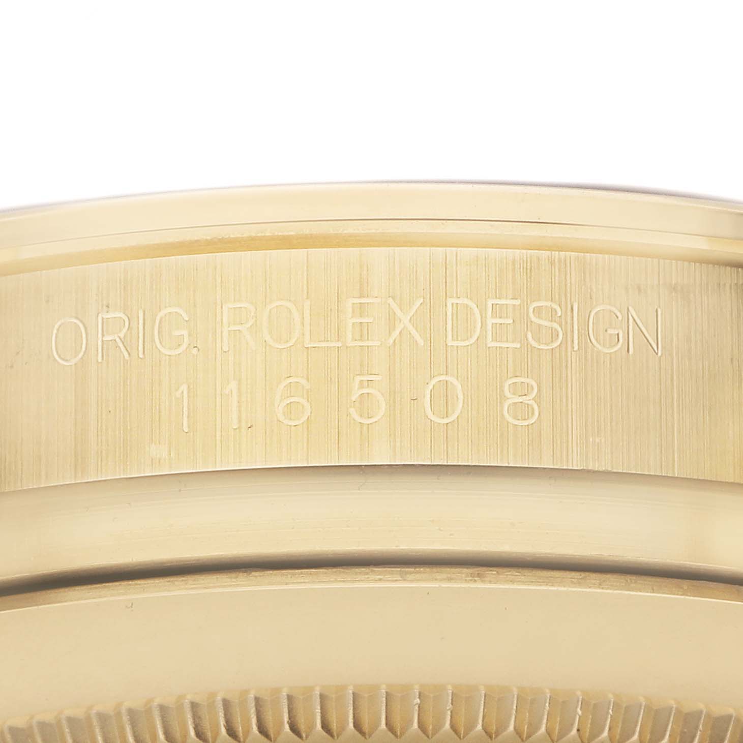 The image shows the engraved side of the bezel of a Rolex Daytona 116508 Men's Yellow Gold Green Dial, model 116508.