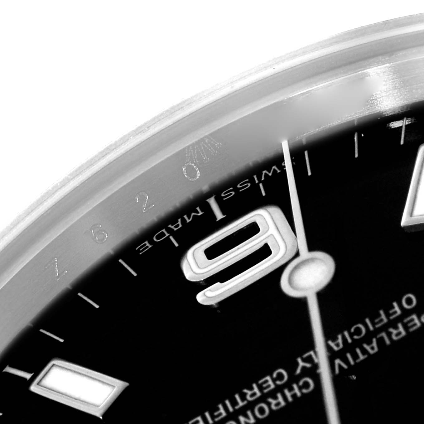 The image focuses on the dial and bezel of the Rolex Explorer 114270 Men's Stainless Steel Black Dial watch, highlighting the "9" numeral and "Swiss Made" text.