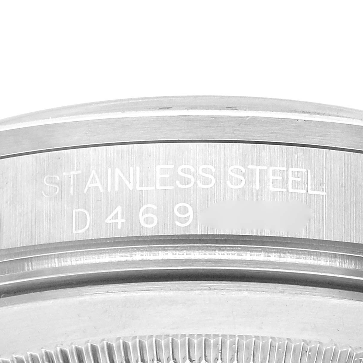 This close-up image shows the side profile of a Rolex Explorer 16570 Men's Stainless Steel White Dial 16570 Men's Stainless Steel White Dial watch, specifically highlighting its stainless steel material and engraved serial number.