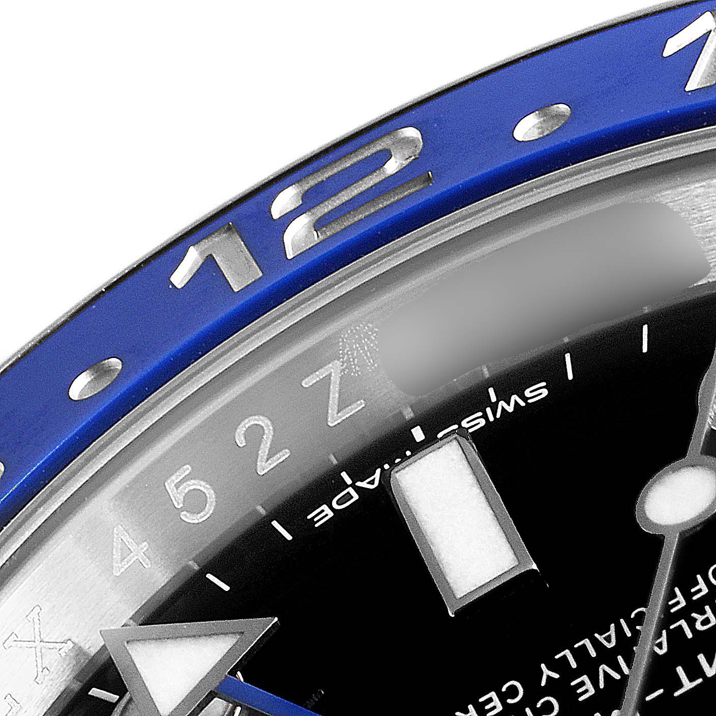 This close-up of a Rolex GMT-Master 116710 Men's Stainless Steel Black Dial 116710 Men's Stainless Steel Black Dial showcases the blue bezel, part of the dial, and the hour hand.
