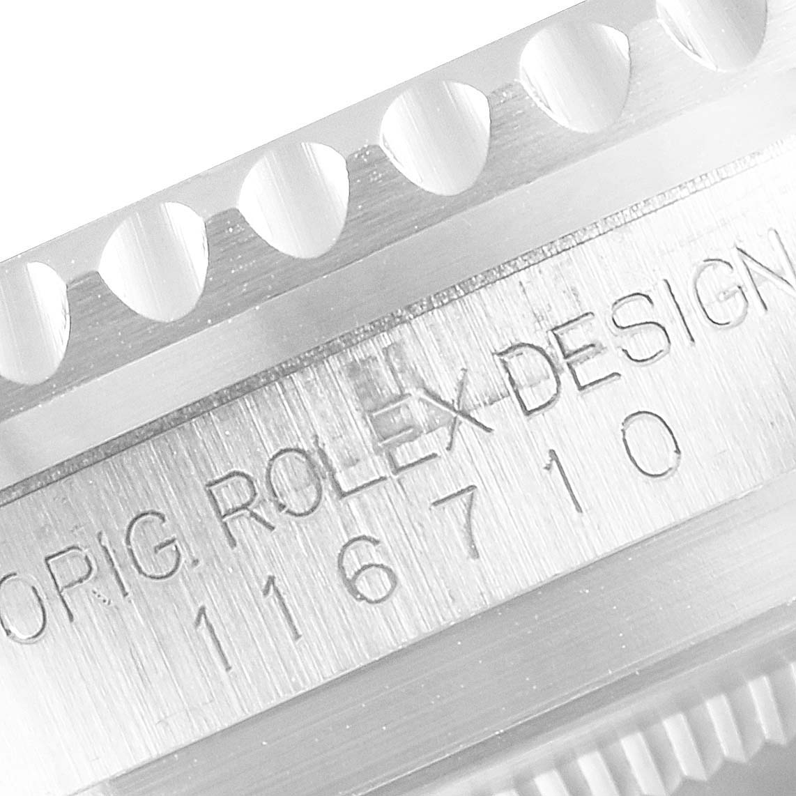 This close-up image shows the engraved side of the bezel and case sides of the Rolex GMT-Master 116710 Men's Stainless Steel Black Dial 116710 Men's Stainless Steel Black Dial model with visible reference numbers.