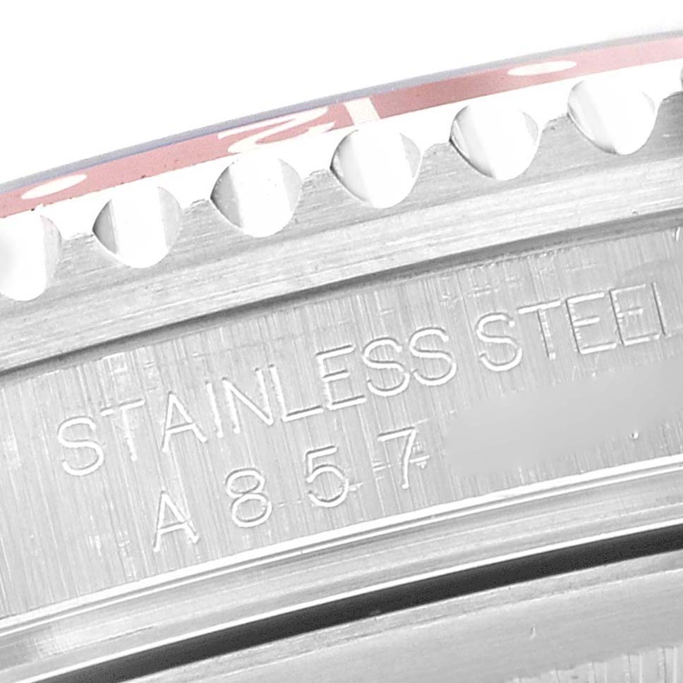 This close-up shows the engraved stainless steel case and bezel edge of a Rolex GMT-Master 16710 Men's Stainless Steel Black Dial 16710 Men's Stainless Steel Black Dial watch.