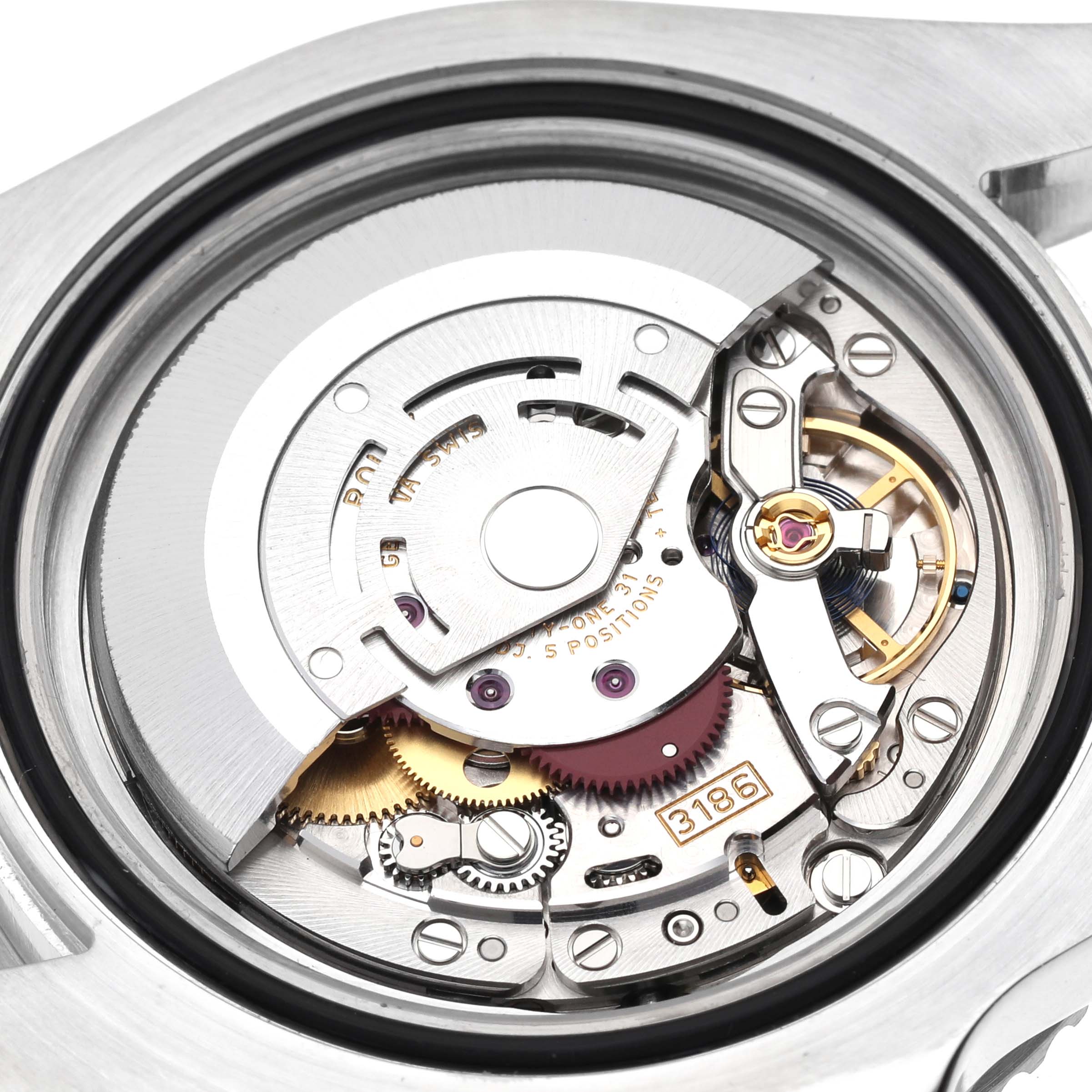 The image shows the exposed movement of a Rolex GMT-Master 116710 Men
s Stainless Steel Black Dial 116710 Men
s Stainless Steel Black Dial watch, highlighting its intricate gears and components.