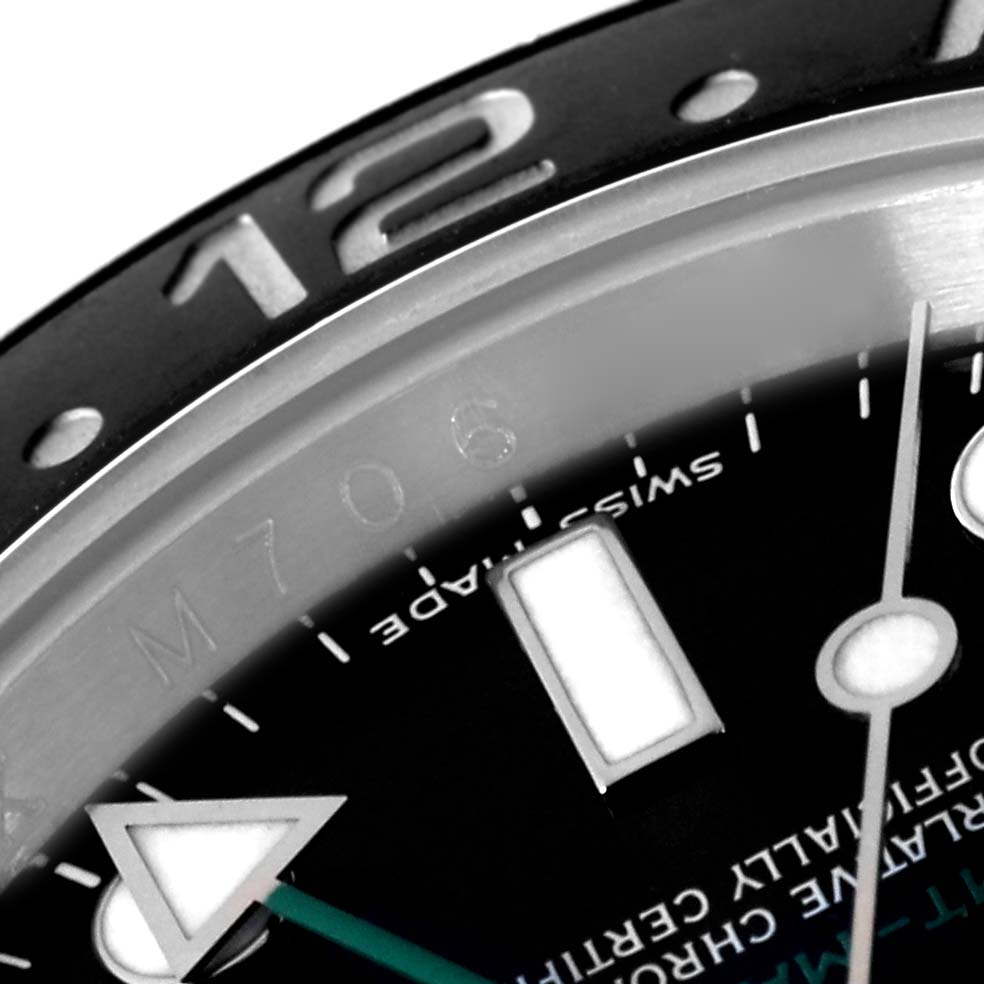 The image shows a close-up of the dial, bezel, and part of the chapter ring of the Rolex GMT-Master 116710 Men
s Stainless Steel Black Dial 116710 Men
s Stainless Steel Black Dial watch.
