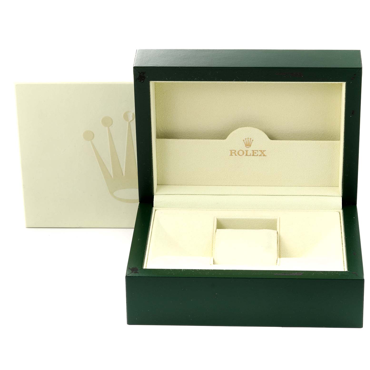 This image shows an open green and beige Rolex box for the GMT-Master model, often used for storing or presenting the watch.