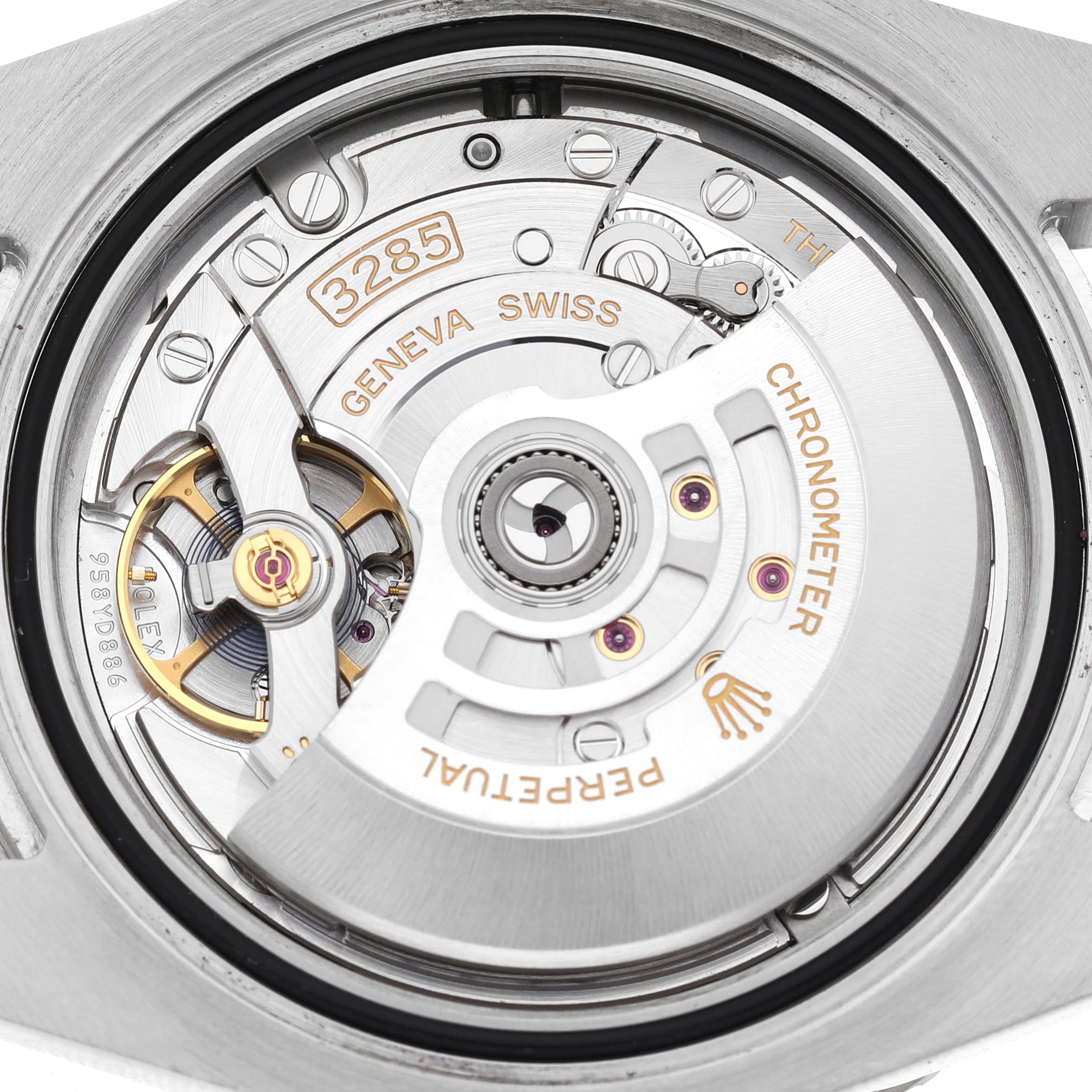 The image shows a close-up of the movement of the Rolex GMT-Master 126710BLRO Men's Stainless Steel Black Dial, focusing on the rotor and internal components.