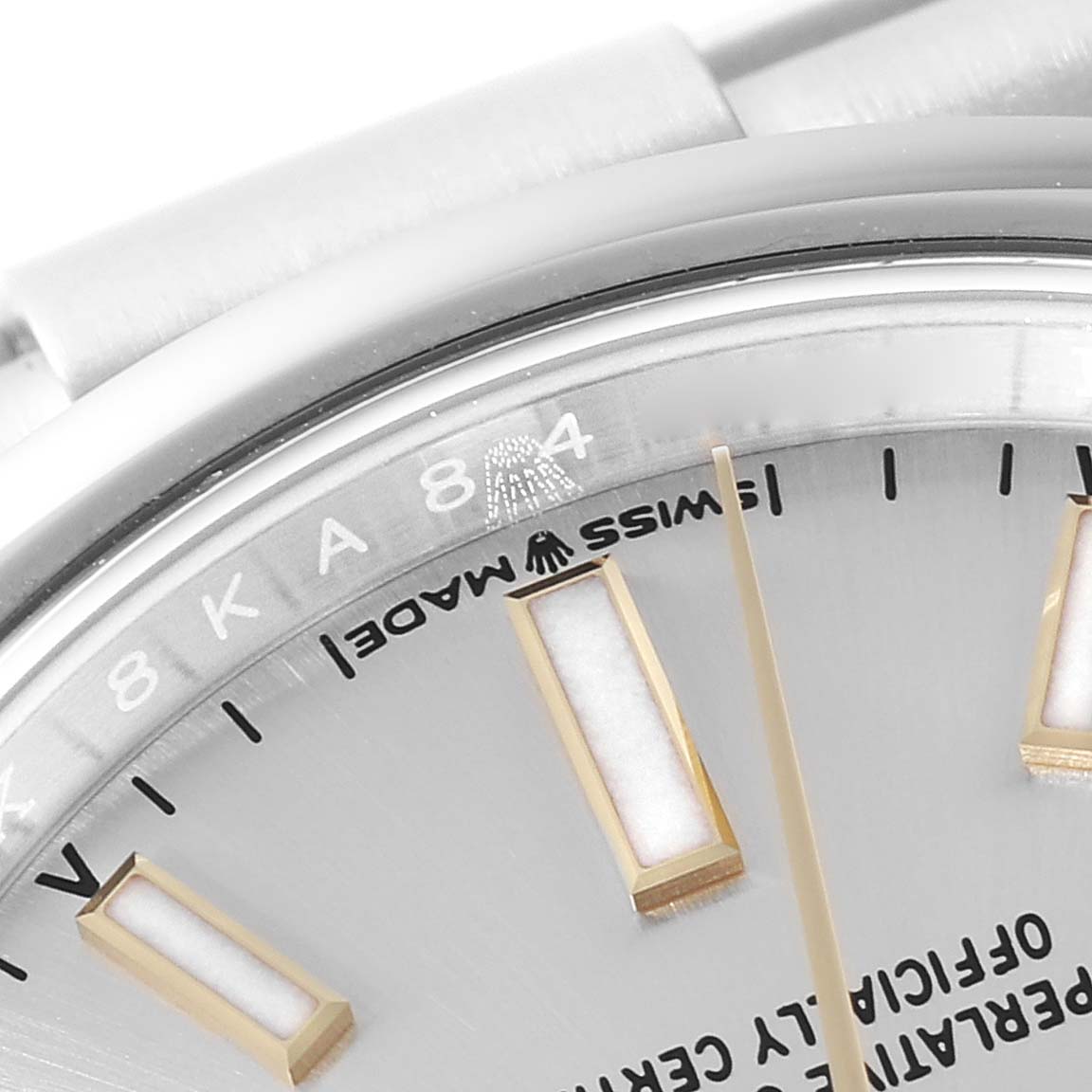 The image shows a close-up angle of the Rolex Oyster Perpetual 124200 Men's Stainless Steel Silver Dial 124200 Men's Stainless Steel Silver Dial watch displaying part of its dial, markers, and the edge of the bezel.