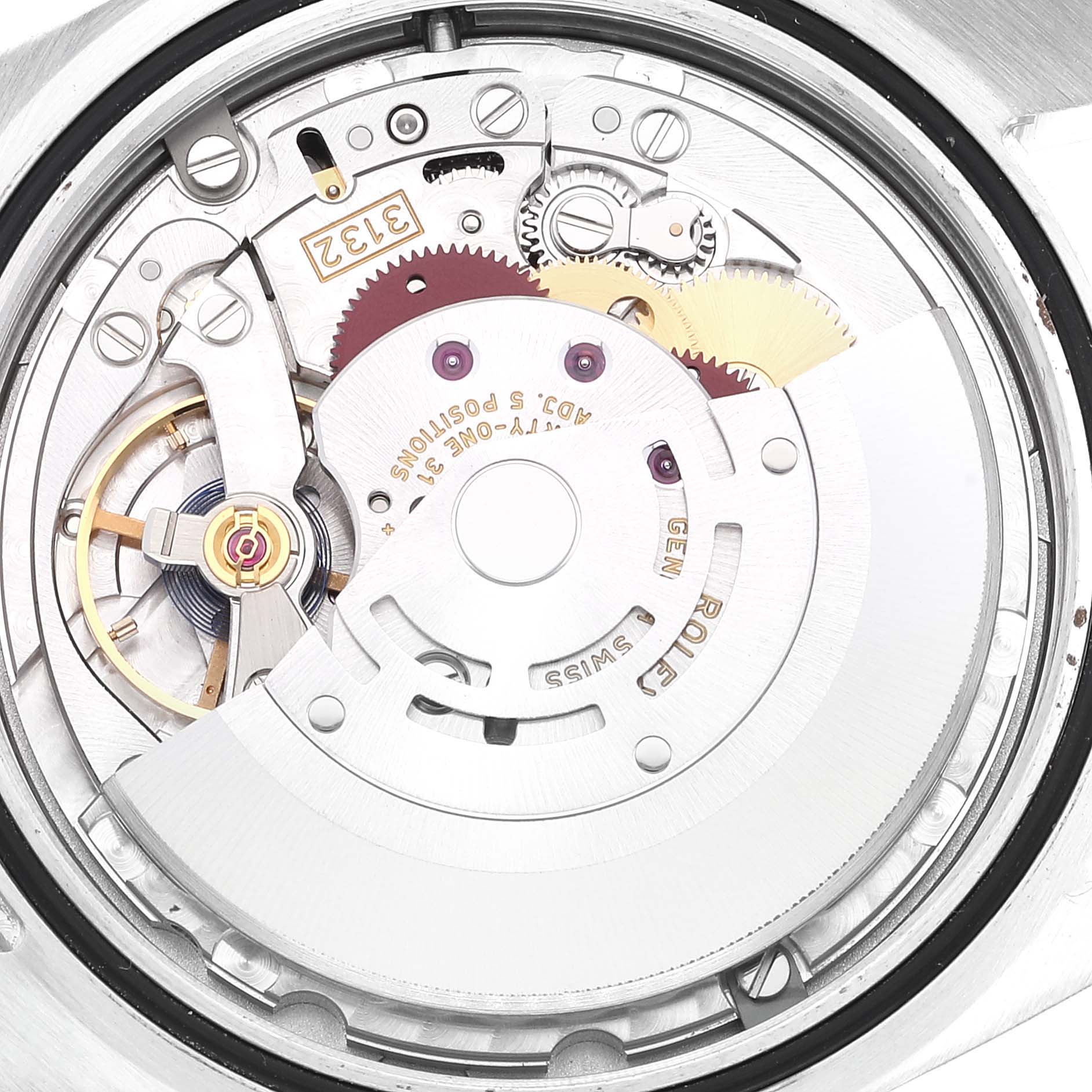 This image shows a close-up of the movement mechanism of a Rolex Oyster Perpetual 114300 Men's Stainless Steel Grey Dial 114300 Men's Stainless Steel Grey Dial watch.
