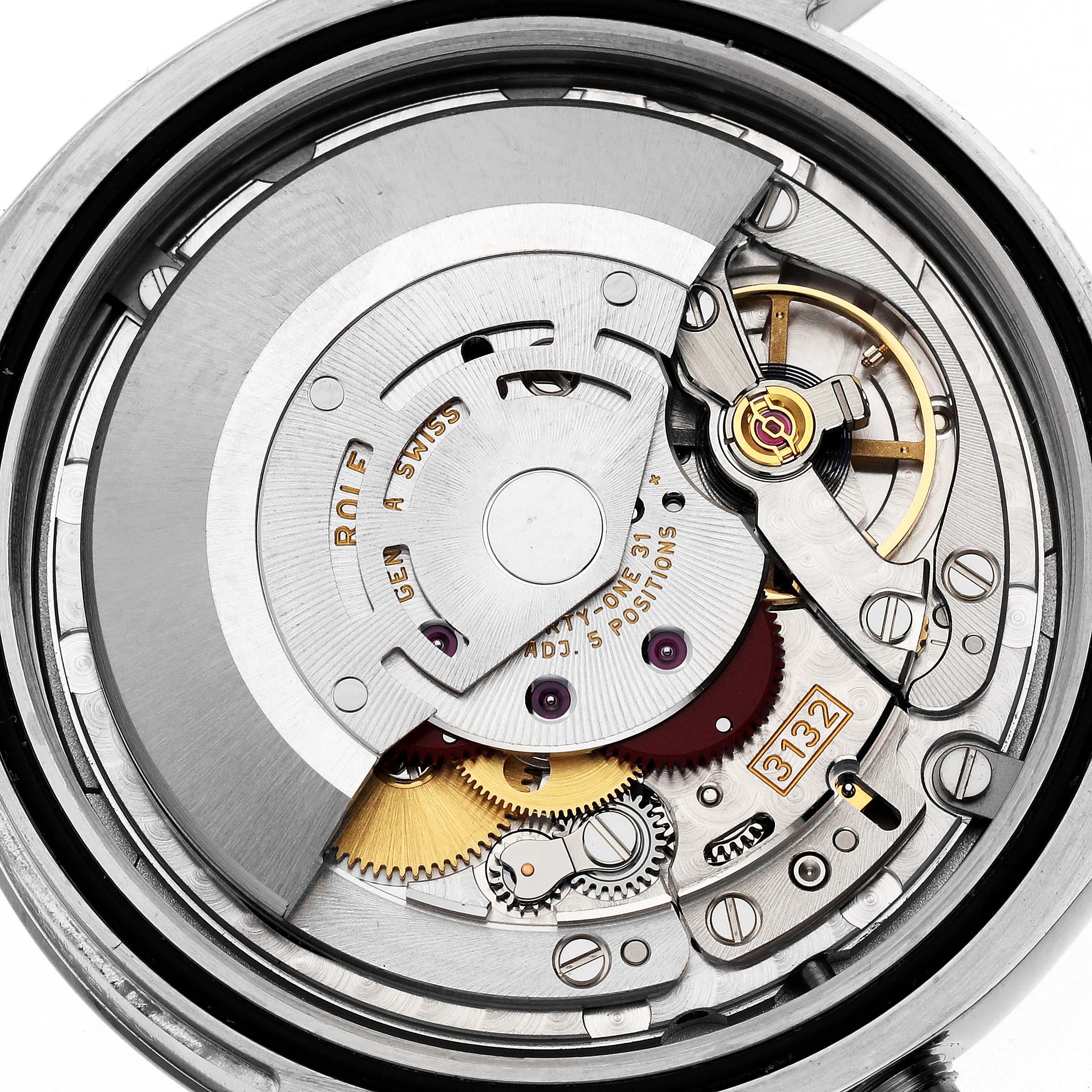 This image shows a close-up view of the internal movement mechanisms of a Rolex Oyster Perpetual 114300 Men's Stainless Steel Grey Dial 114300 Men's Stainless Steel Grey Dial watch.
