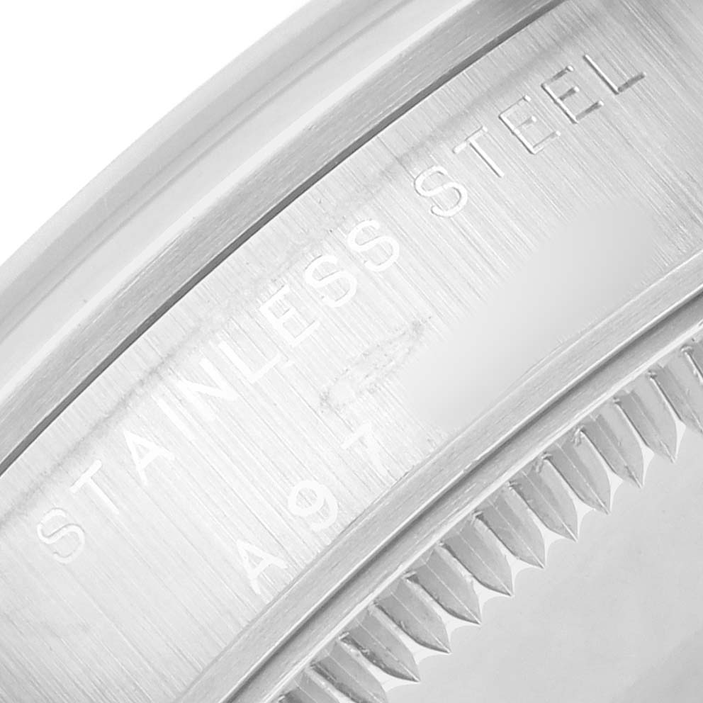 The image shows a close-up of the side engraving on the Rolex Oyster Perpetual 77080 Women's Stainless Steel Silver Dial, focusing on the stainless steel bezel.