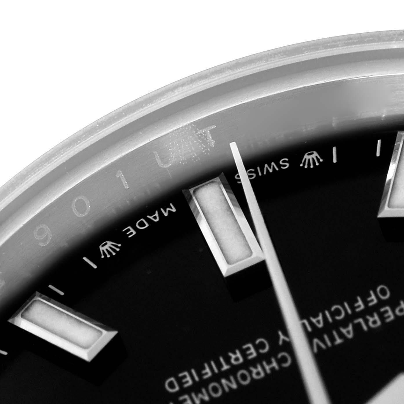 The image shows a close-up angle of the Rolex Oyster Perpetual 276200 Women's Stainless Steel Black Dial watch face, highlighting the minute markers and "Swiss Made" text.