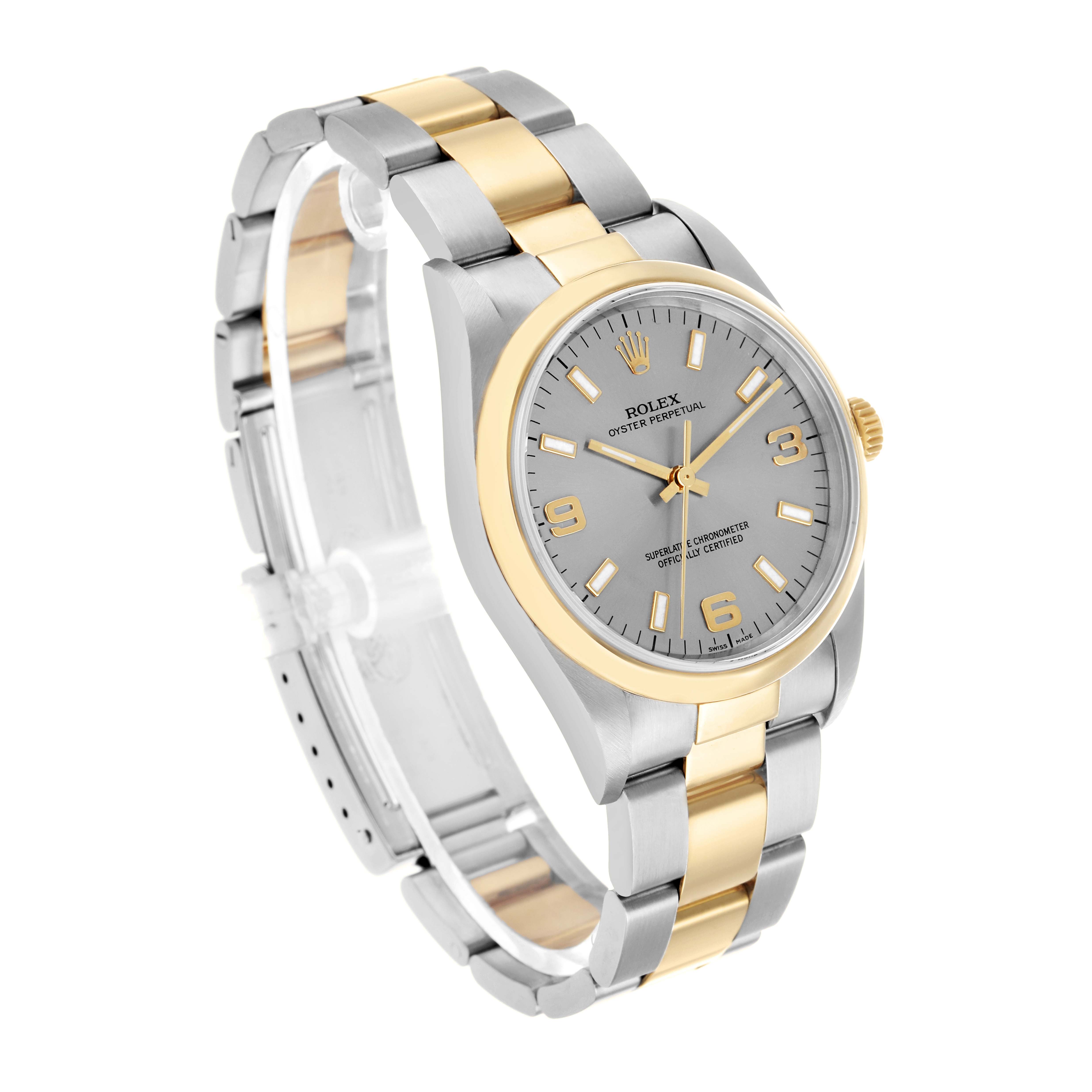 The Rolex Oyster Perpetual 14203 Men's Steel and Gold (two tone) Silver Dial watch is shown at a slight angle, highlighting the dial, bezel, and two-tone bracelet.