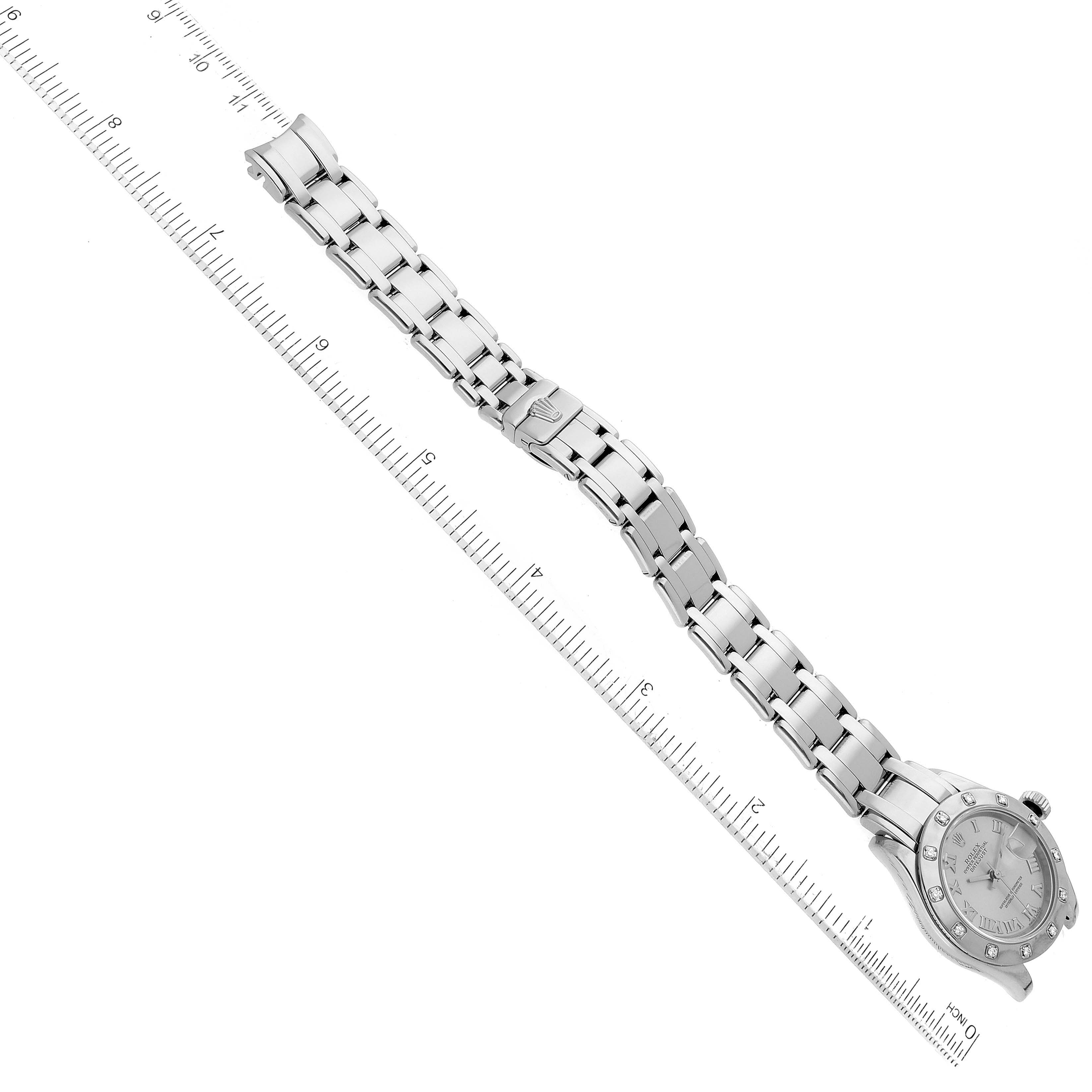The image shows the side angle of a Rolex Pearlmaster 69319 Women
s White Gold Silver Dial 69319 Women
s White Gold Silver Dial watch, highlighting the entire bracelet and the watch face.