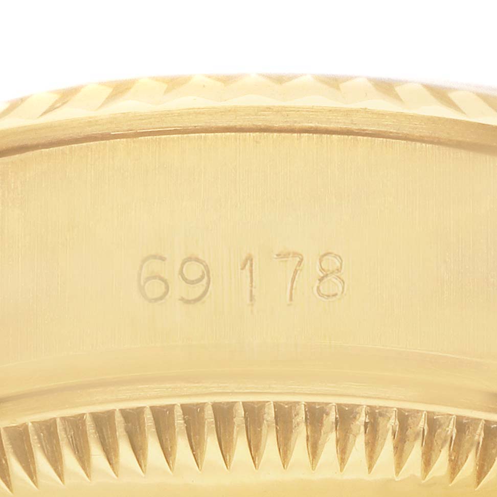The image shows a close-up of the rim with a model number engraved, likely the side or back of a Rolex President 69178 Women's Yellow Gold Champagne Dial watch.