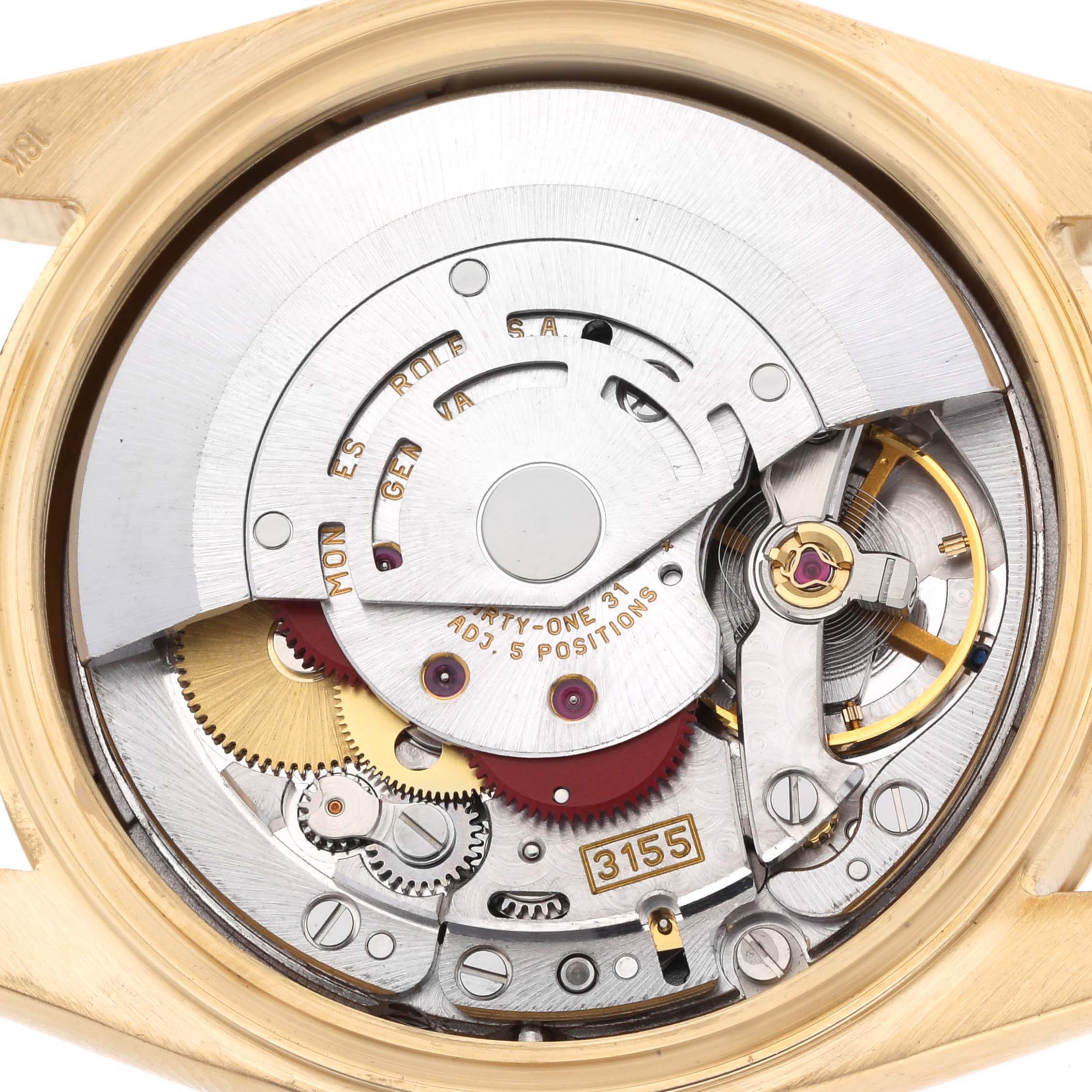 The image shows the internal mechanism of a Rolex President 118238 Men's Yellow Gold Champagne Dial watch from a top-down angle, highlighting gears and the rotor.