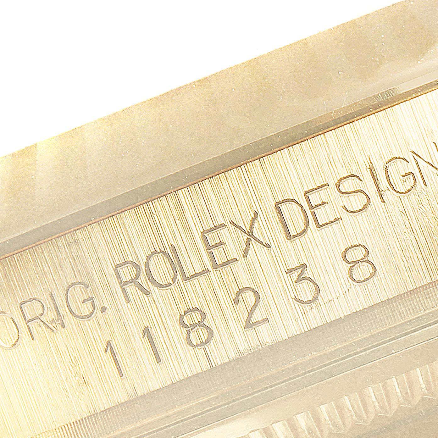 The image shows a close-up angle of the Rolex President 118238 Men's Yellow Gold Champagne Dial 118238 Men's Yellow Gold Champagne Dial watch case side engraving, highlighting the model number 118238.