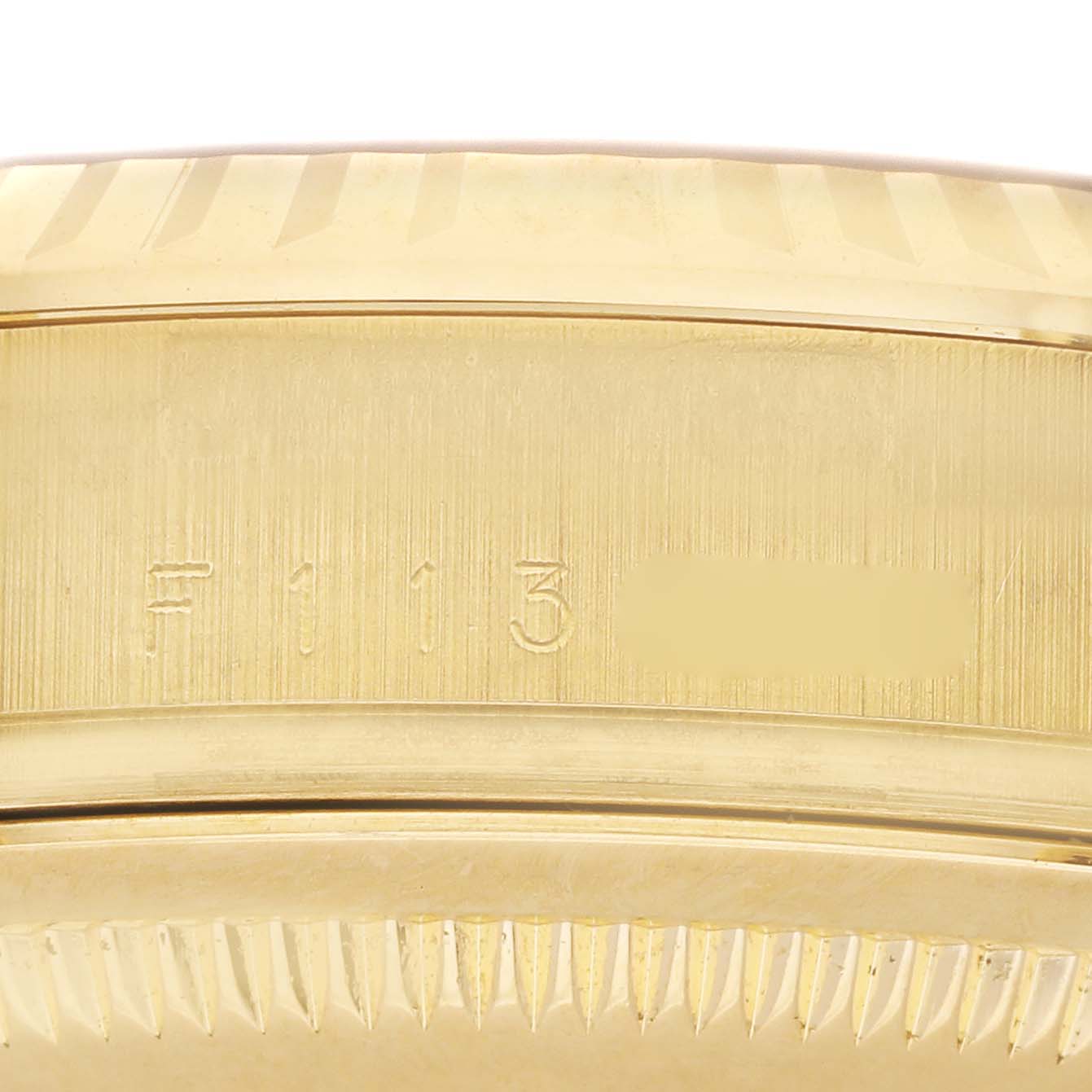 This image shows a close-up angle of the bezel and case side of a Rolex President 118238 Men's Yellow Gold Champagne Dial 118238 Men's Yellow Gold Champagne Dial model watch, highlighting its serial number.