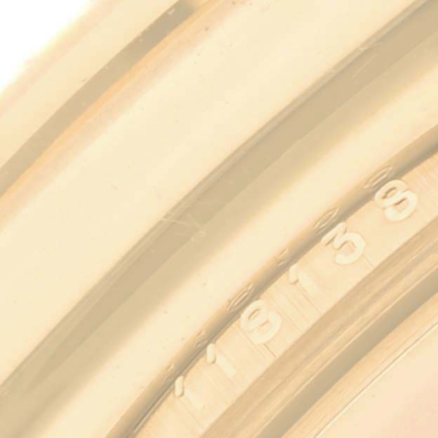 This image shows a close-up of the engraved case back of a Rolex President 118138 Men
s Yellow Gold Green Dial 118138 Men
s Yellow Gold Green Dial model watch.