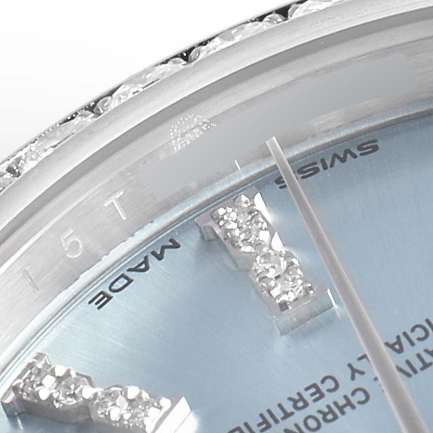 This close-up image shows the bezel, part of the dial, and the diamond hour markers of a Rolex President 279136 Women's Platinum Blue Dial 279136 Women's Platinum Blue Dial model watch.