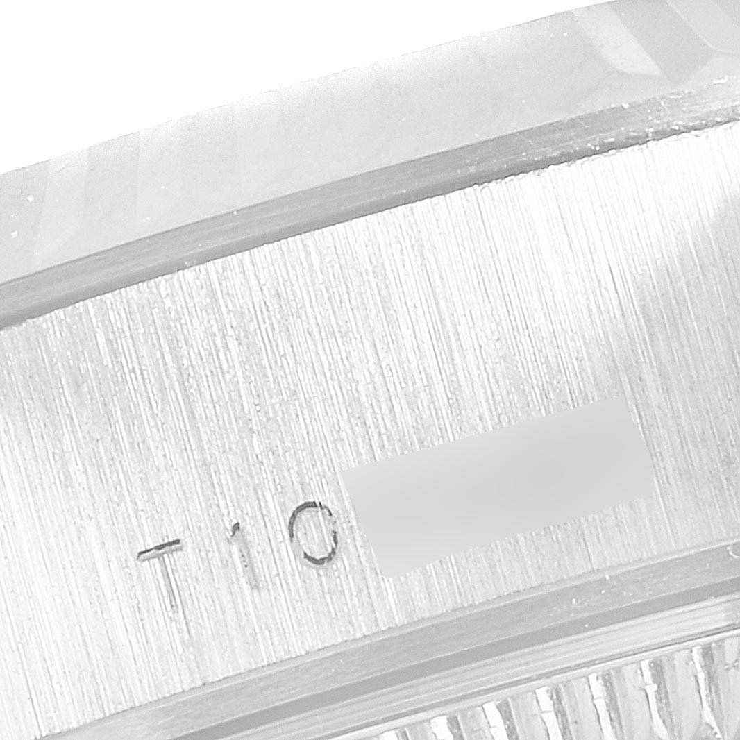 This image shows a close-up of the serial number inscription on the side of the bezel of a Rolex President 69179 Women's White Gold Silver Dial 69179 Women's White Gold Silver Dial model watch.