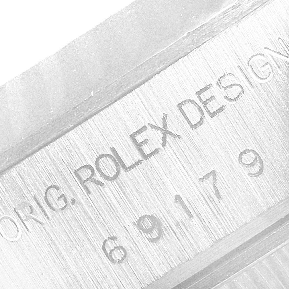 This image shows a close-up of the serial number engraving on a Rolex President 69179 Women's White Gold Silver Dial 69179 Women's White Gold Silver Dial model watch case.