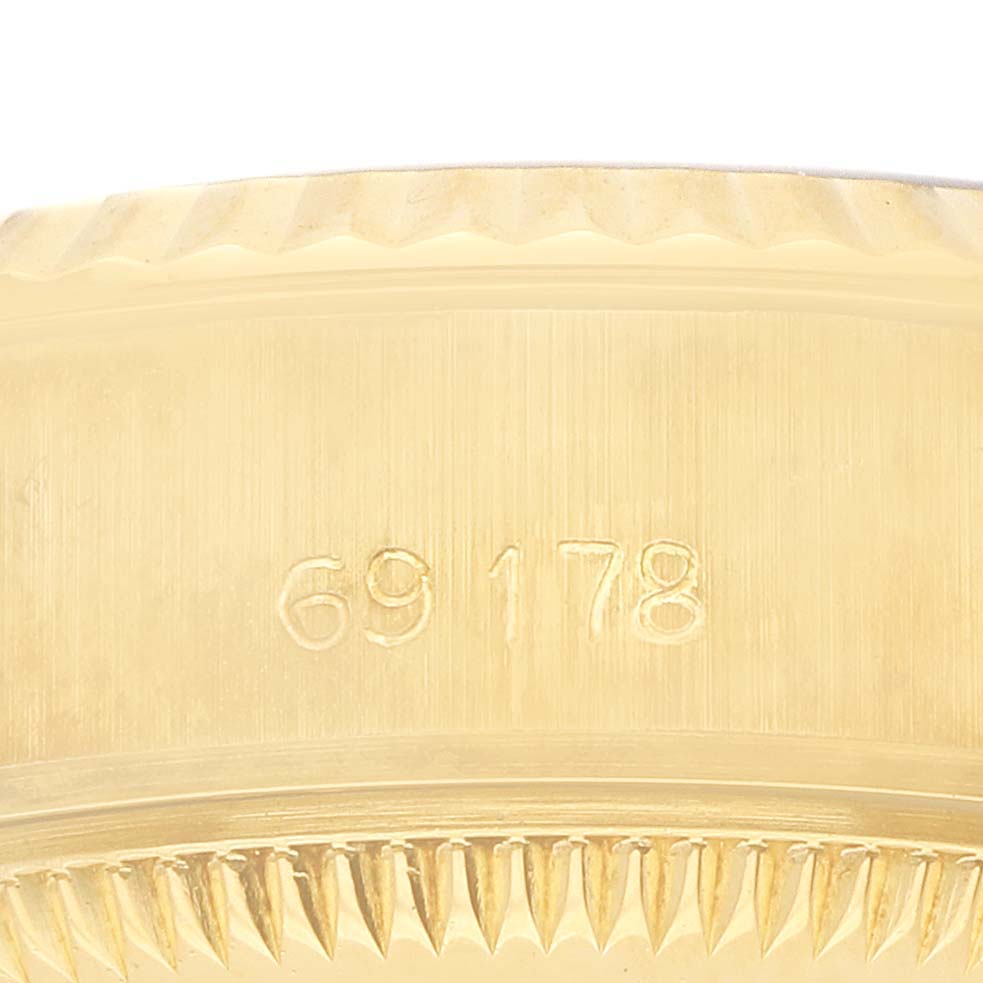 The image shows the side view of a Rolex President 69178 Women's Yellow Gold Champagne Dial model's case, displaying its reference number and part of the fluted bezel.