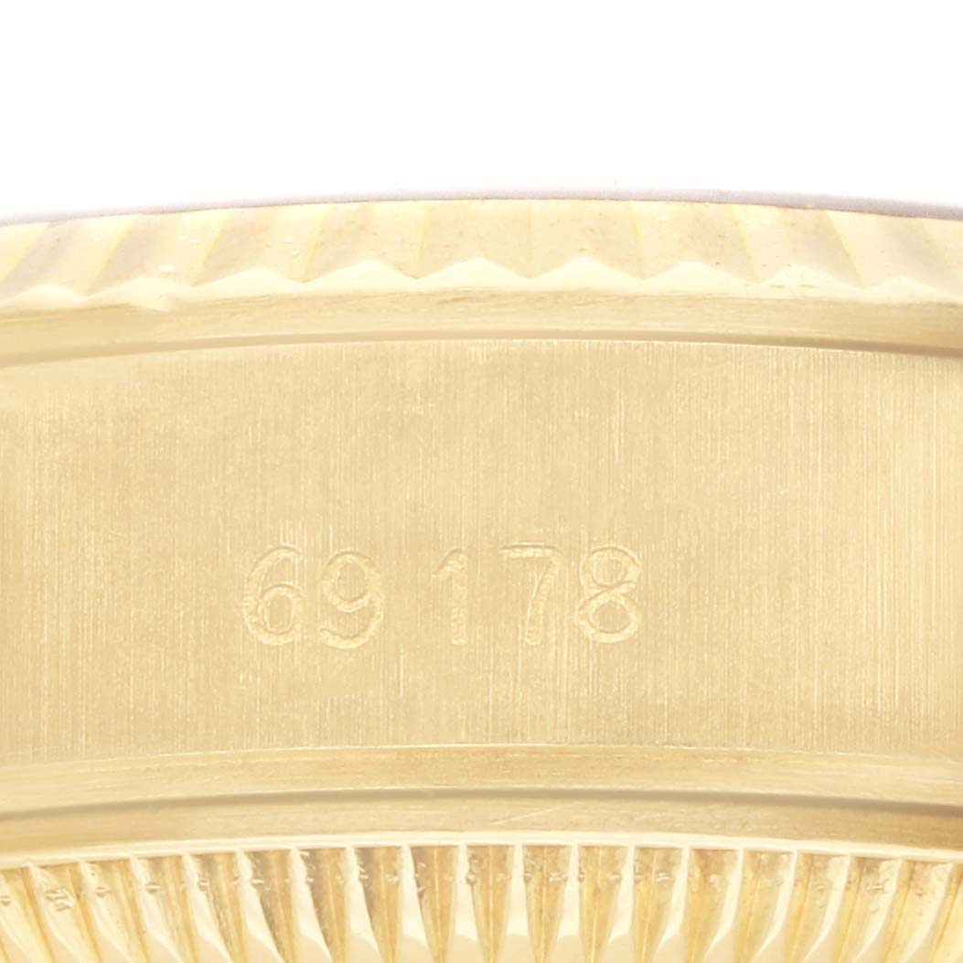 The image shows a close-up side view of the case edge and model number of the Rolex President 69178 Women's Yellow Gold Champagne Dial watch.