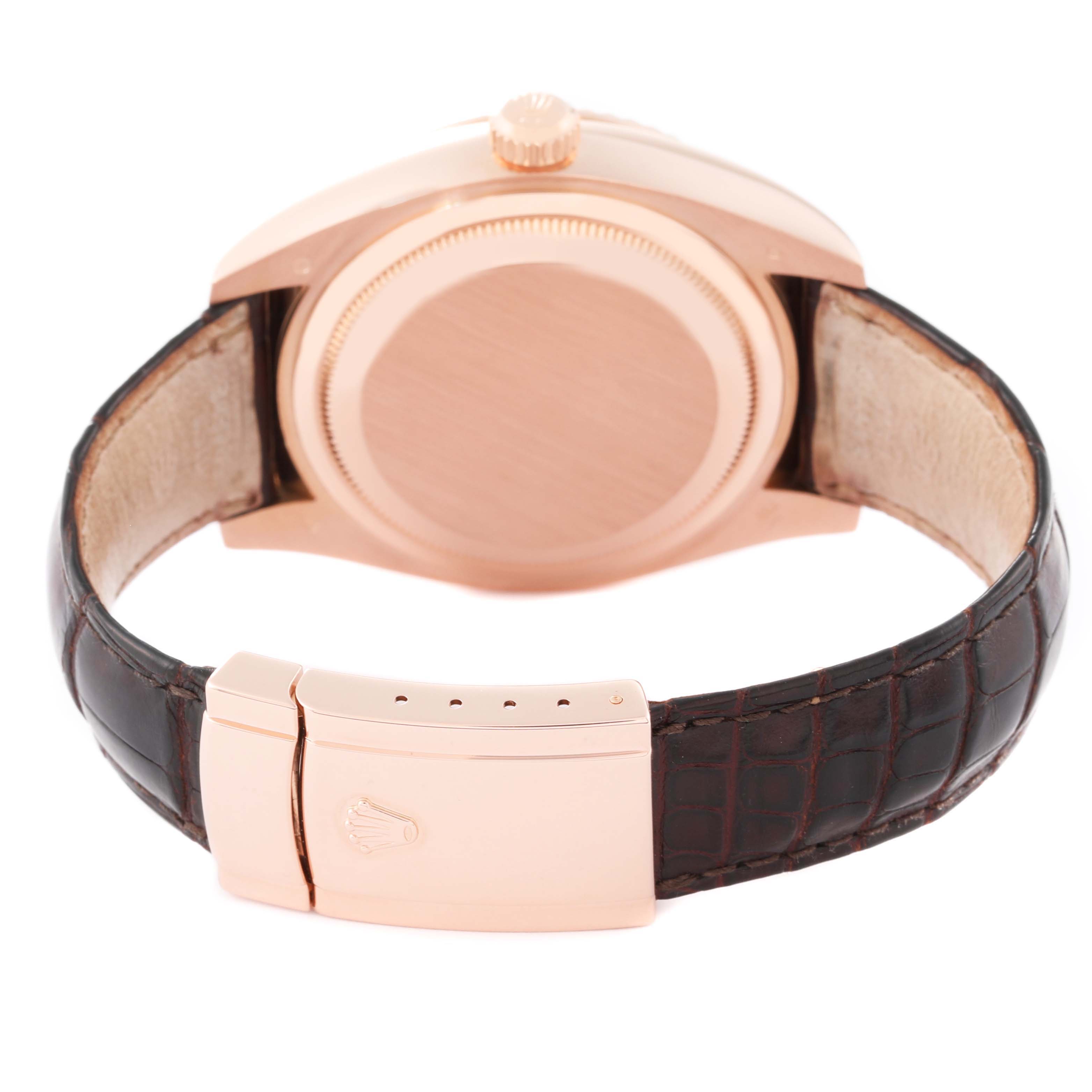 The Rolex Sky-Dweller 326135 Men's Rose Gold Silver Dial watch is shown from the back, displaying the case, crown, and clasp on a leather strap.