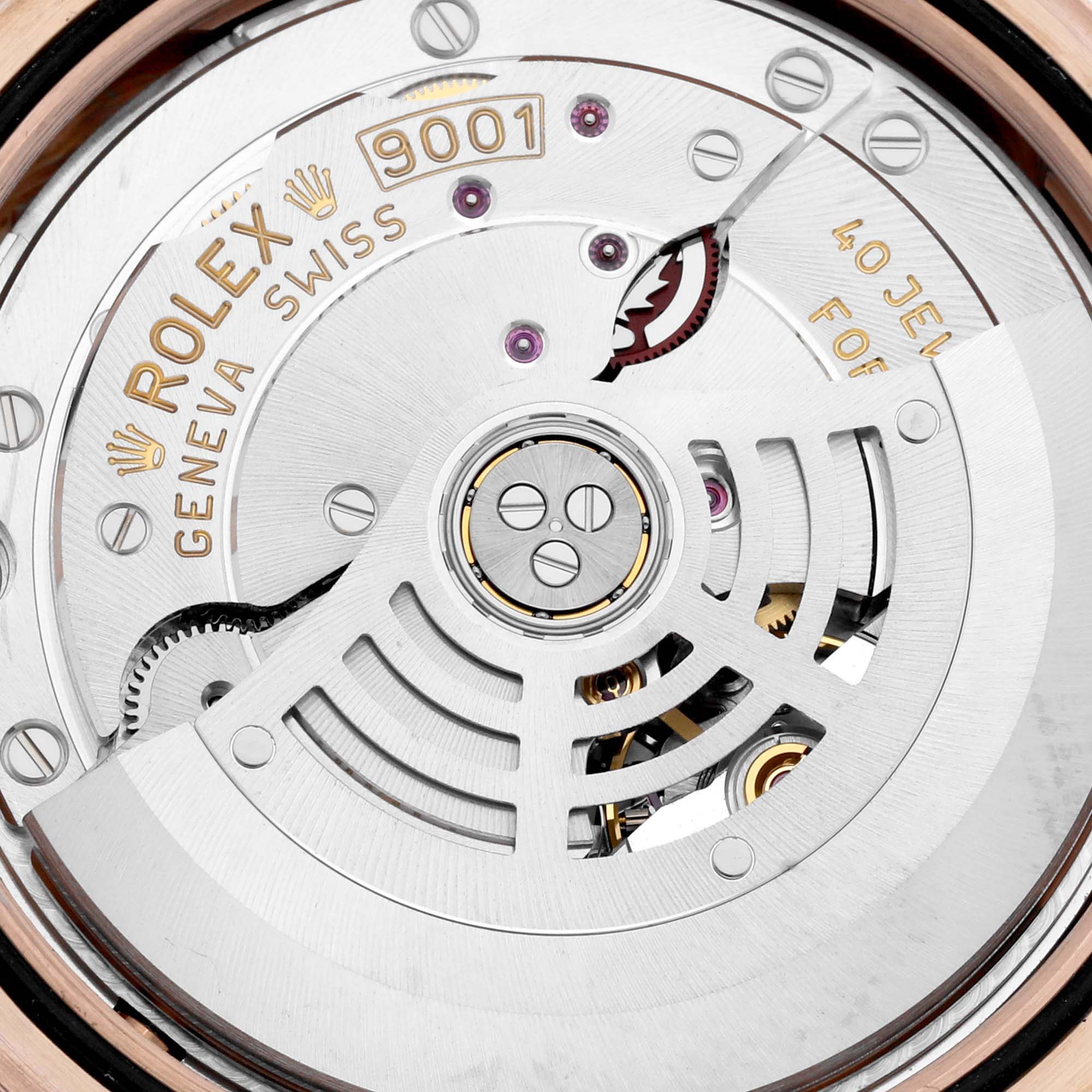 The image shows the oscillating rotor and movement parts of a Rolex Sky-Dweller 326135 Men's Rose Gold Silver Dial watch at a close-up angle.