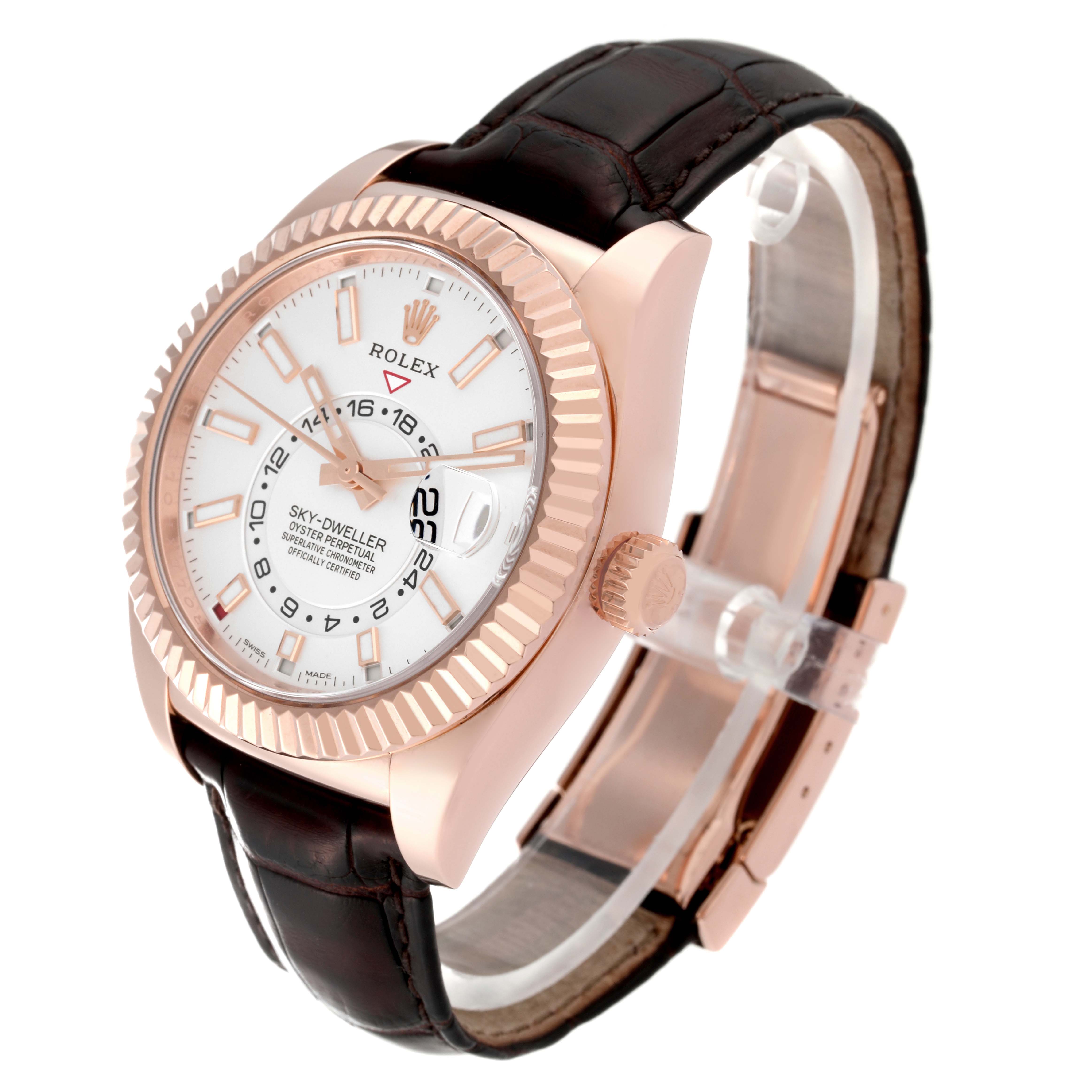 The Rolex Sky-Dweller 326135 Men's Rose Gold Silver Dial is shown at a three-quarter angle, displaying the watch face, bezel, crown, and leather strap.