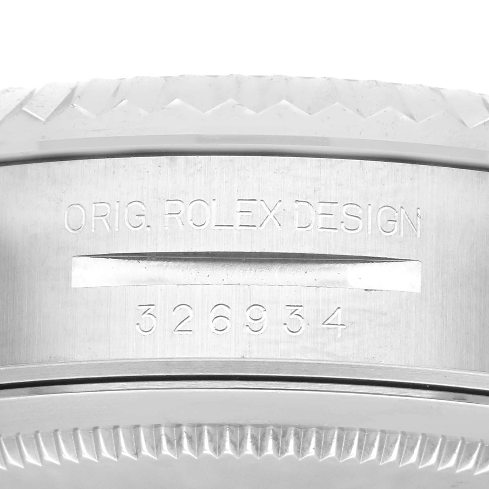 This image shows a close-up of the side casing of the Rolex Sky-Dweller 326934 Men
s Stainless Steel White Dial 326934 Men
s Stainless Steel White Dial, highlighting the engraved model number and "Orig. Rolex Design".