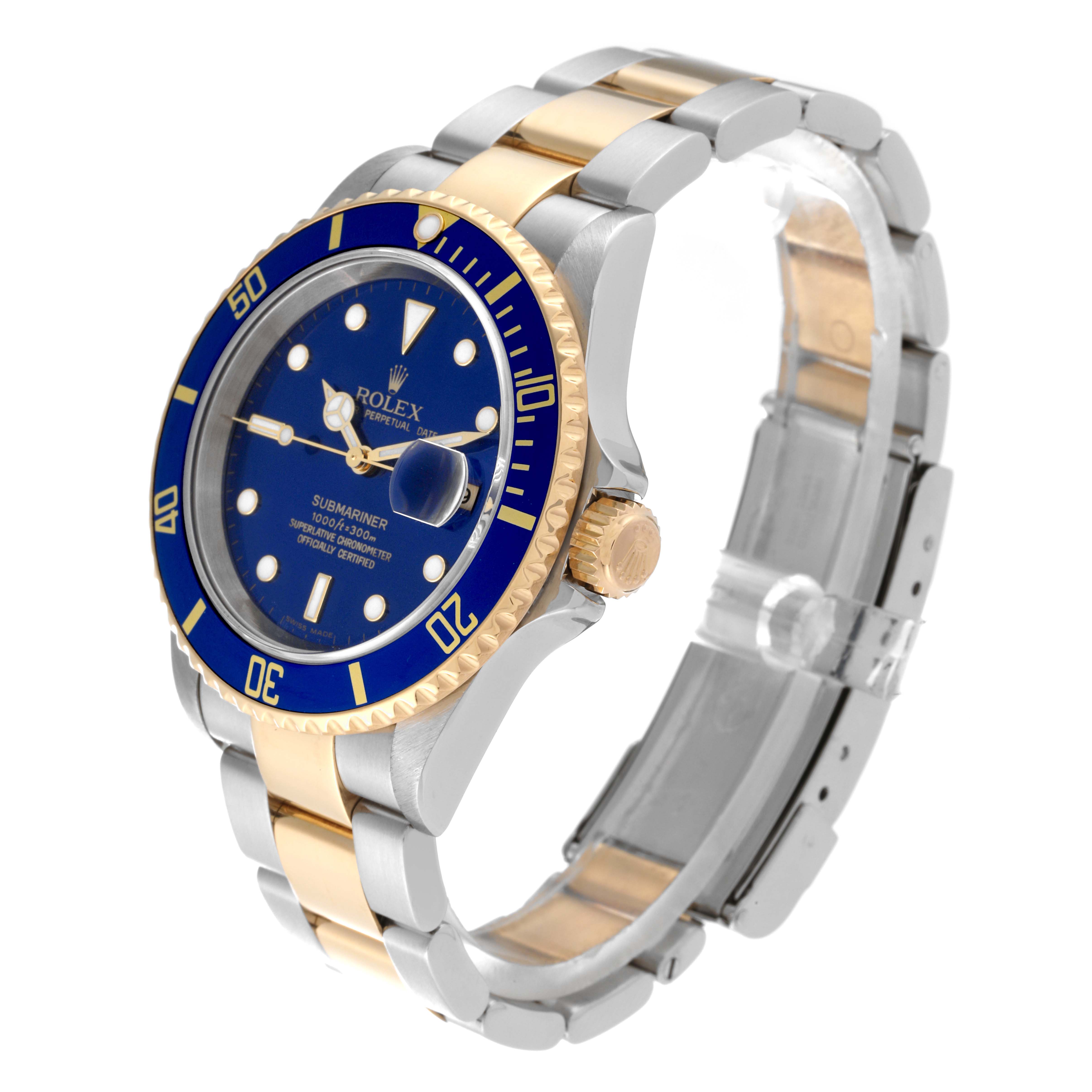 The Rolex Submariner 16613 Men's Steel and Gold (two tone) Blue Dial 16613 Men's Steel and Gold (two tone) Blue Dial watch is shown at a slight angle, displaying its blue dial, gold bezel, and two-tone bracelet.